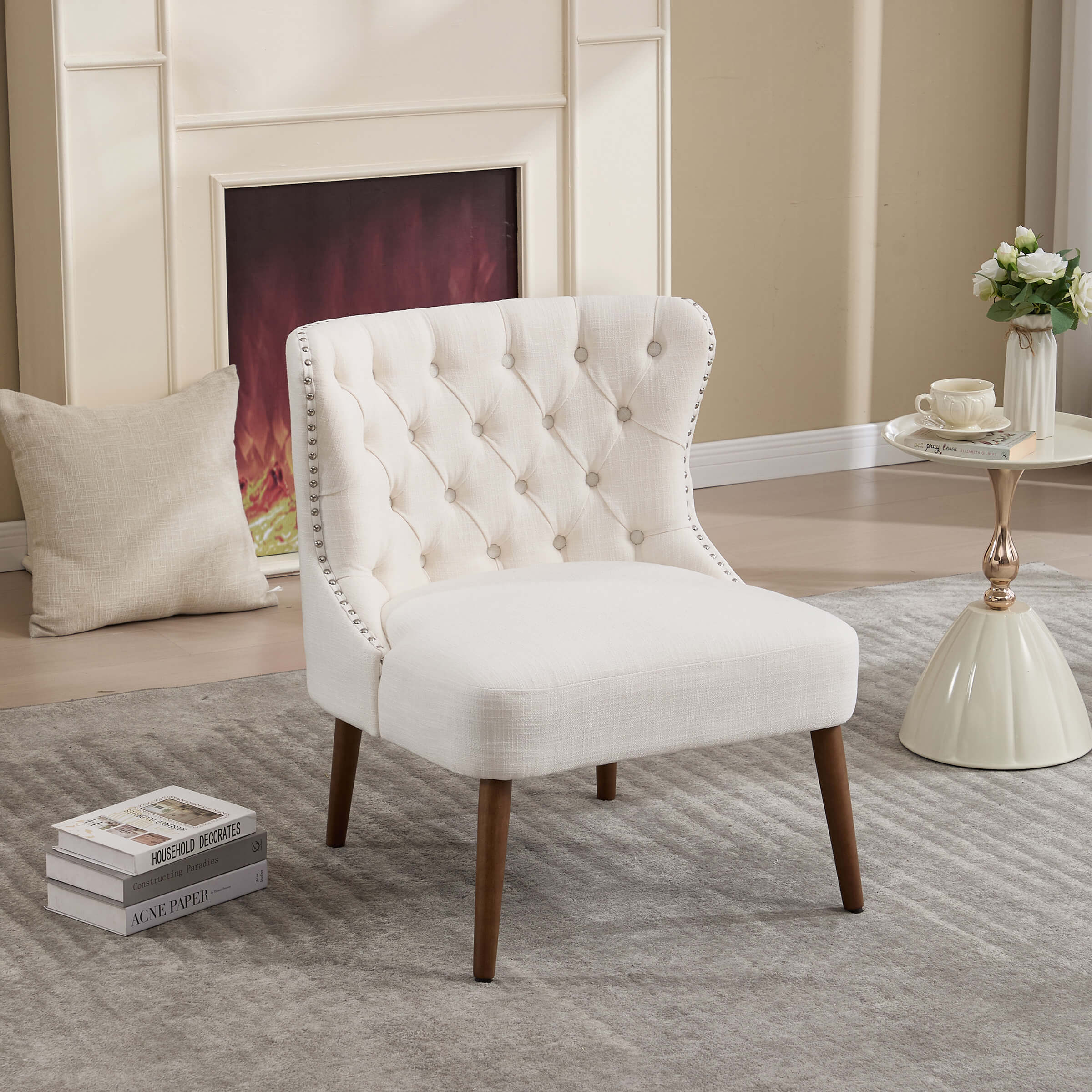 Cream/ivory slipper chair with tufted back and wooden legs in room