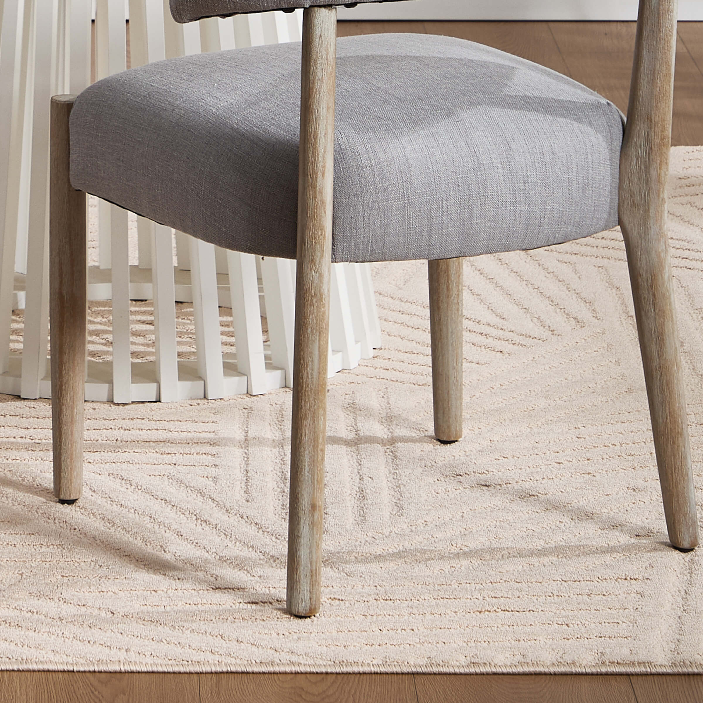 Chair leg and table rug in room