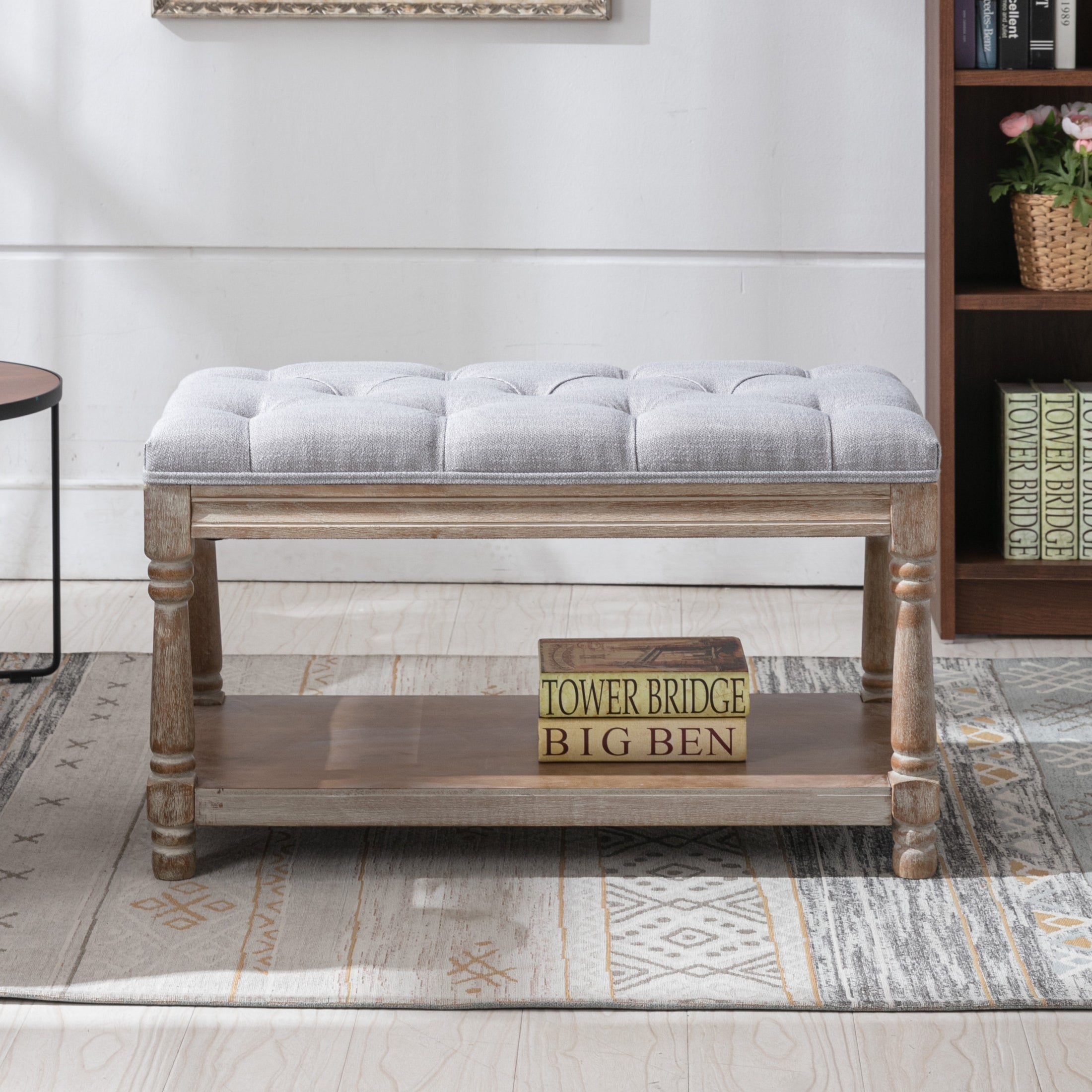 Tufted bench in a bookshelf room