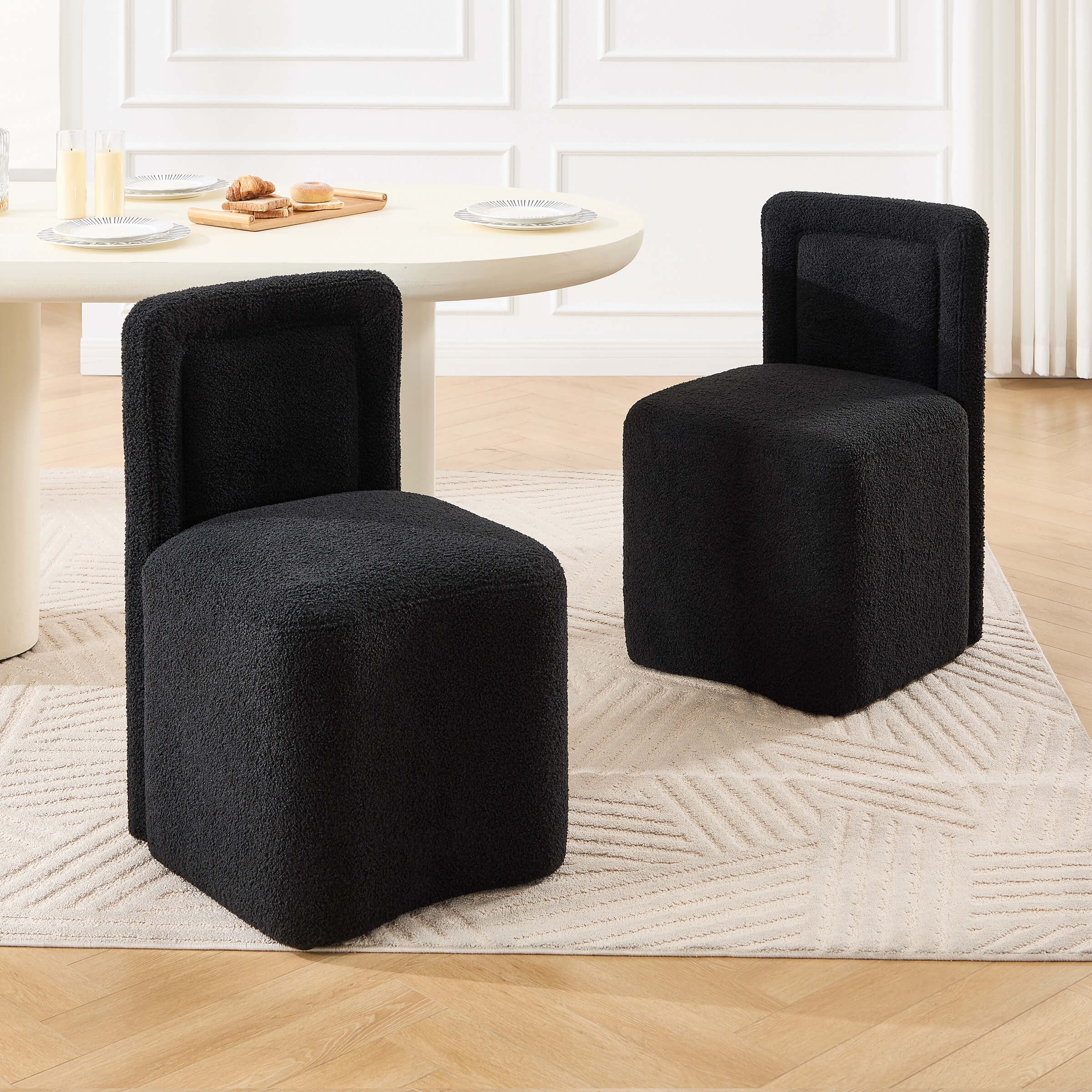 Black version of the chairs set around table