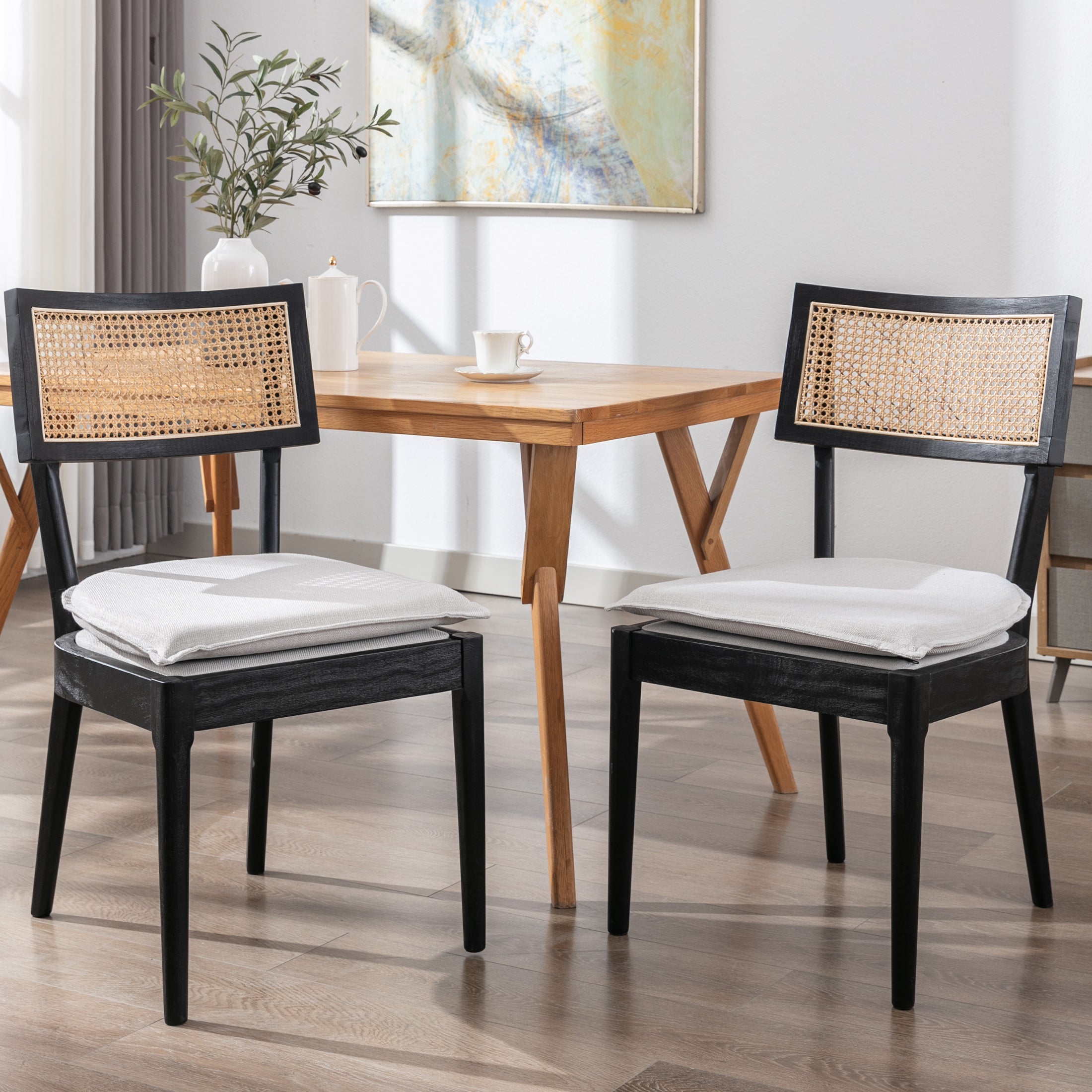 Two-tone dining chairs and table in black and natural wood
