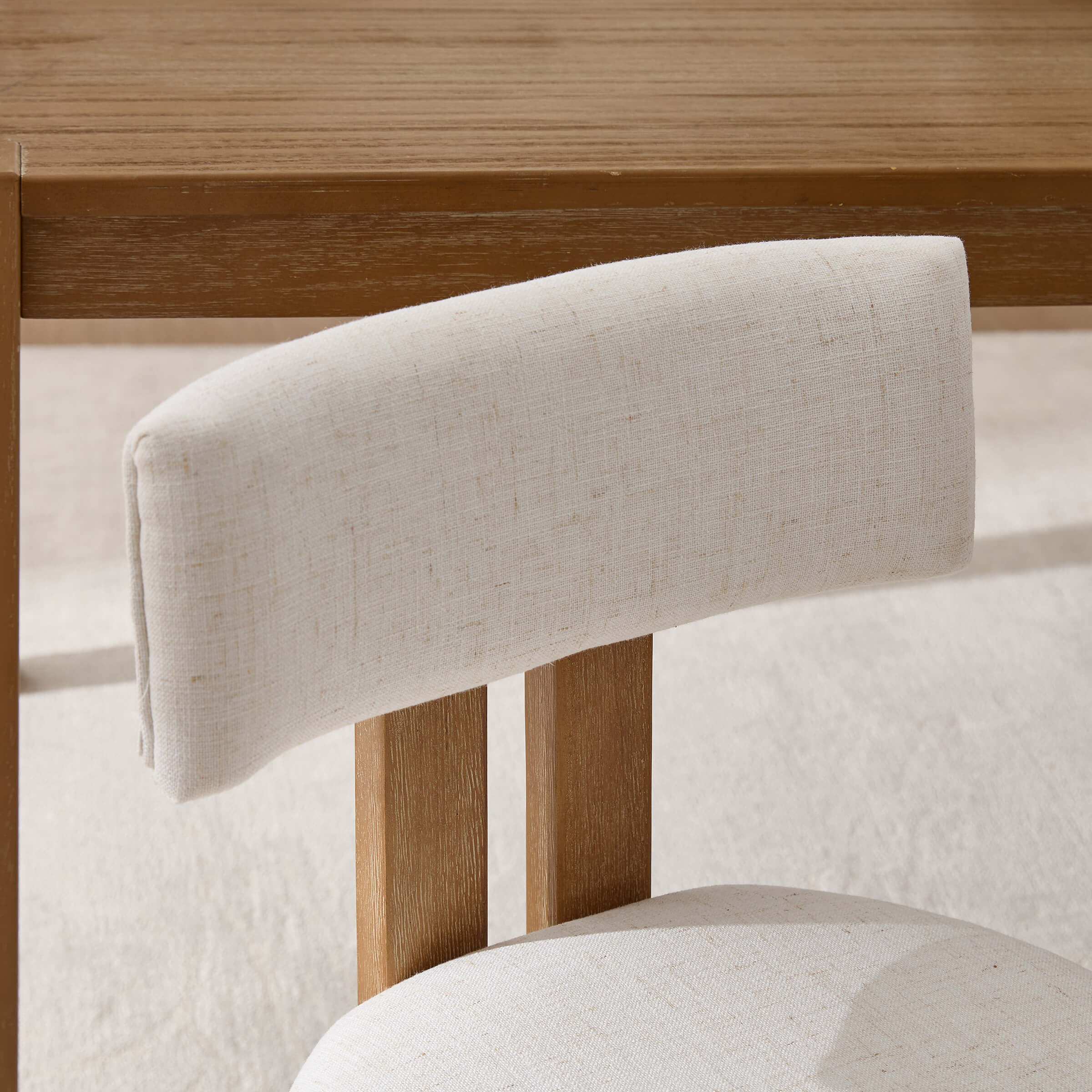 Close-up of chair back on white fabric