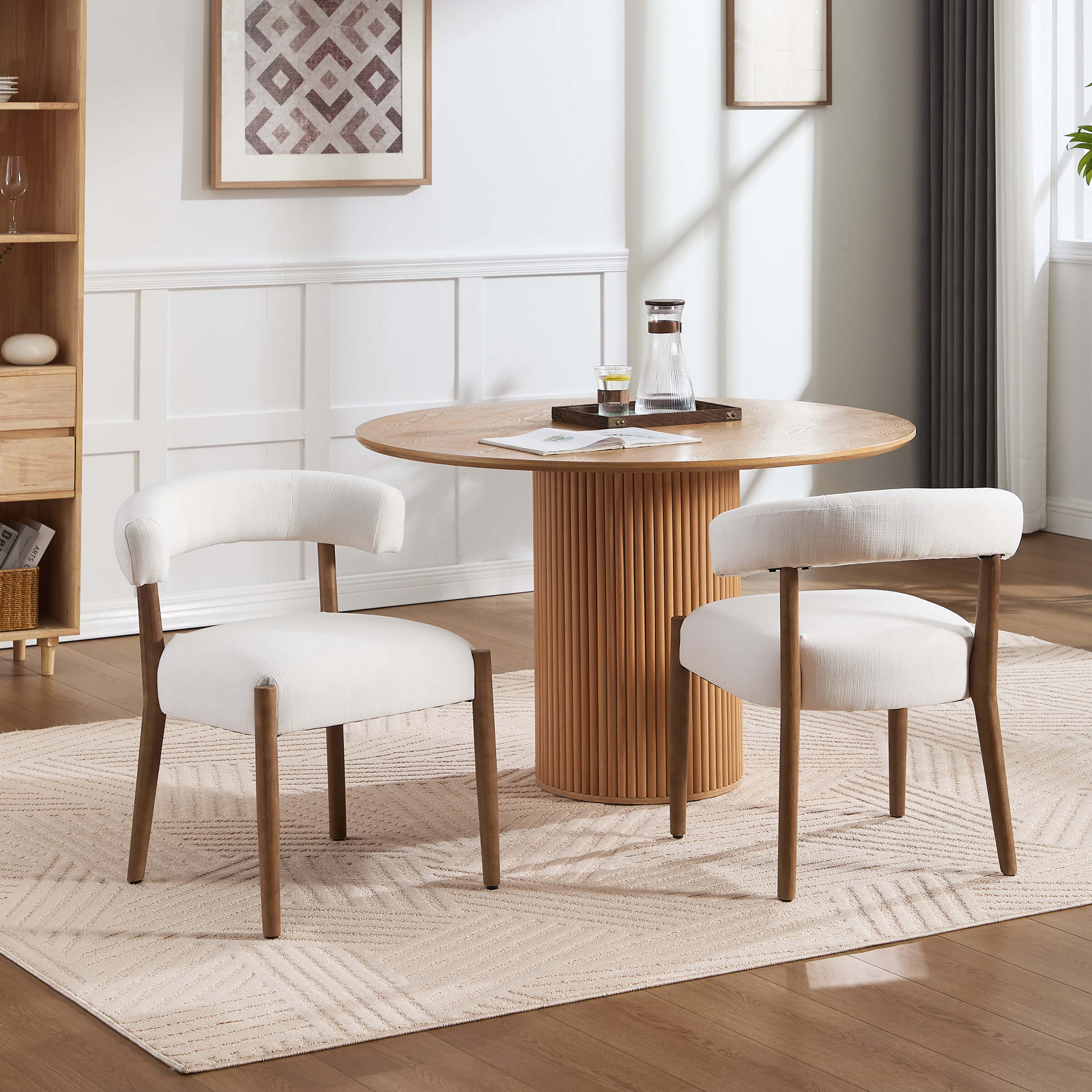 Round dining table with four chairs in living room