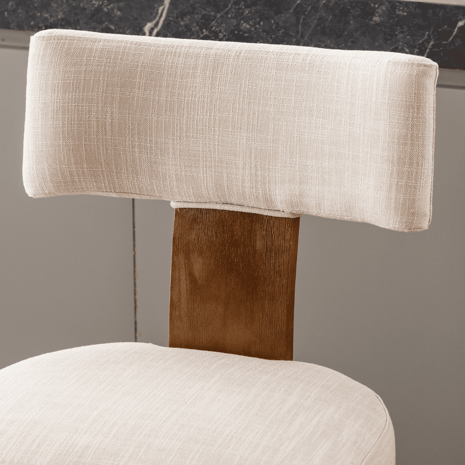 Cream upholstered cushion with visible weave