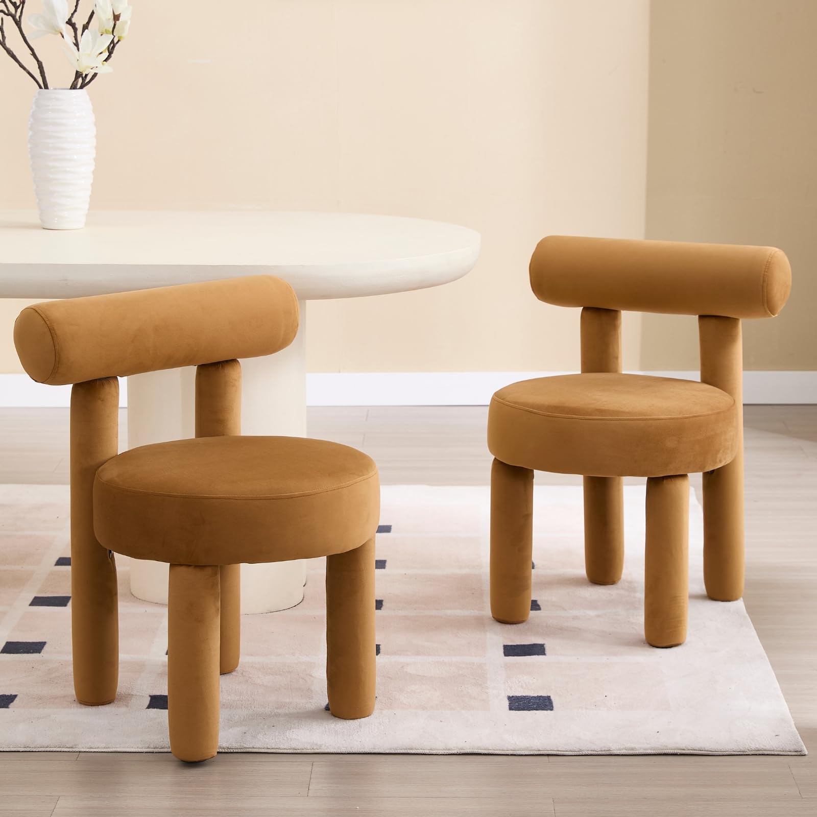 Beige chairs near dresser