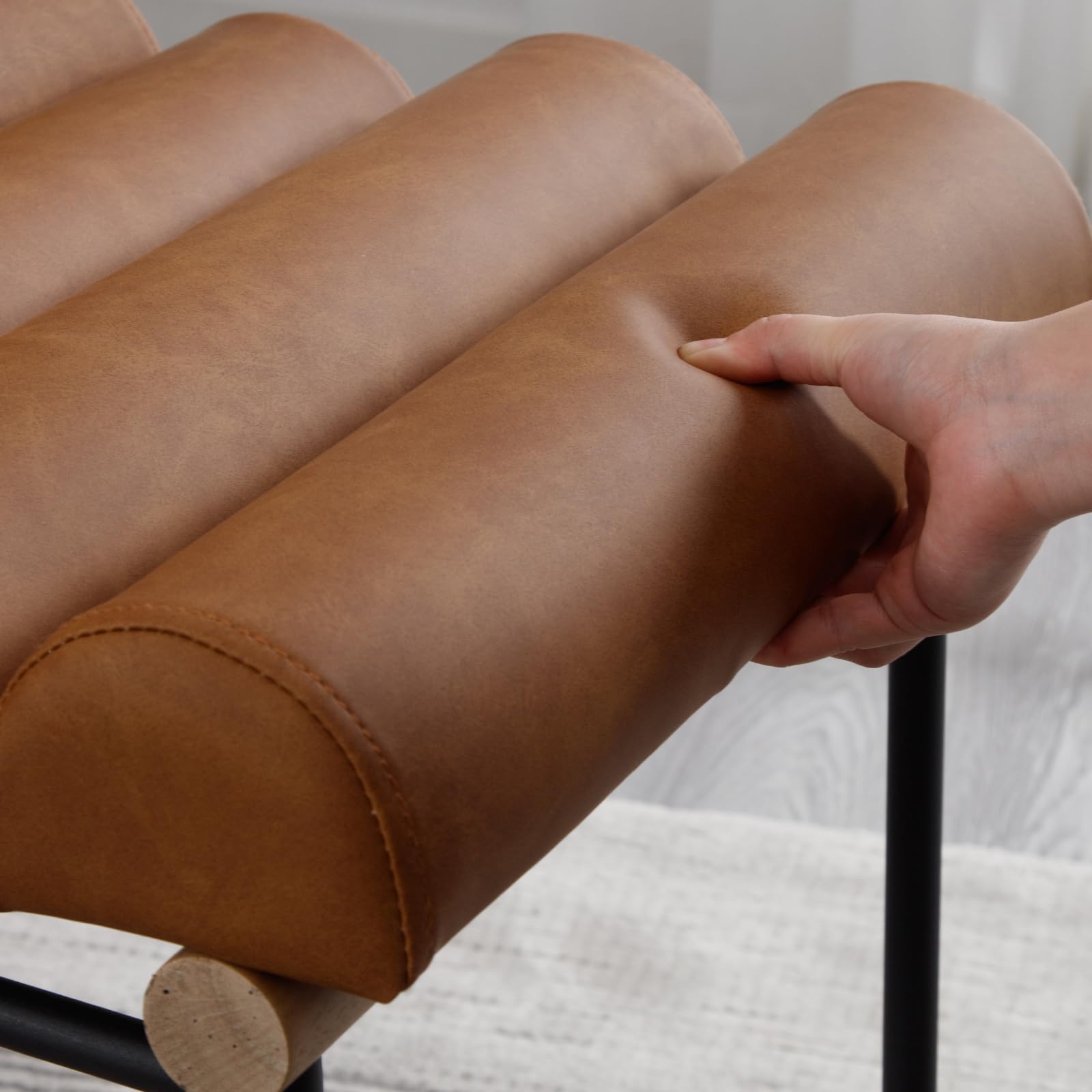 Hand pressing brown upholstery