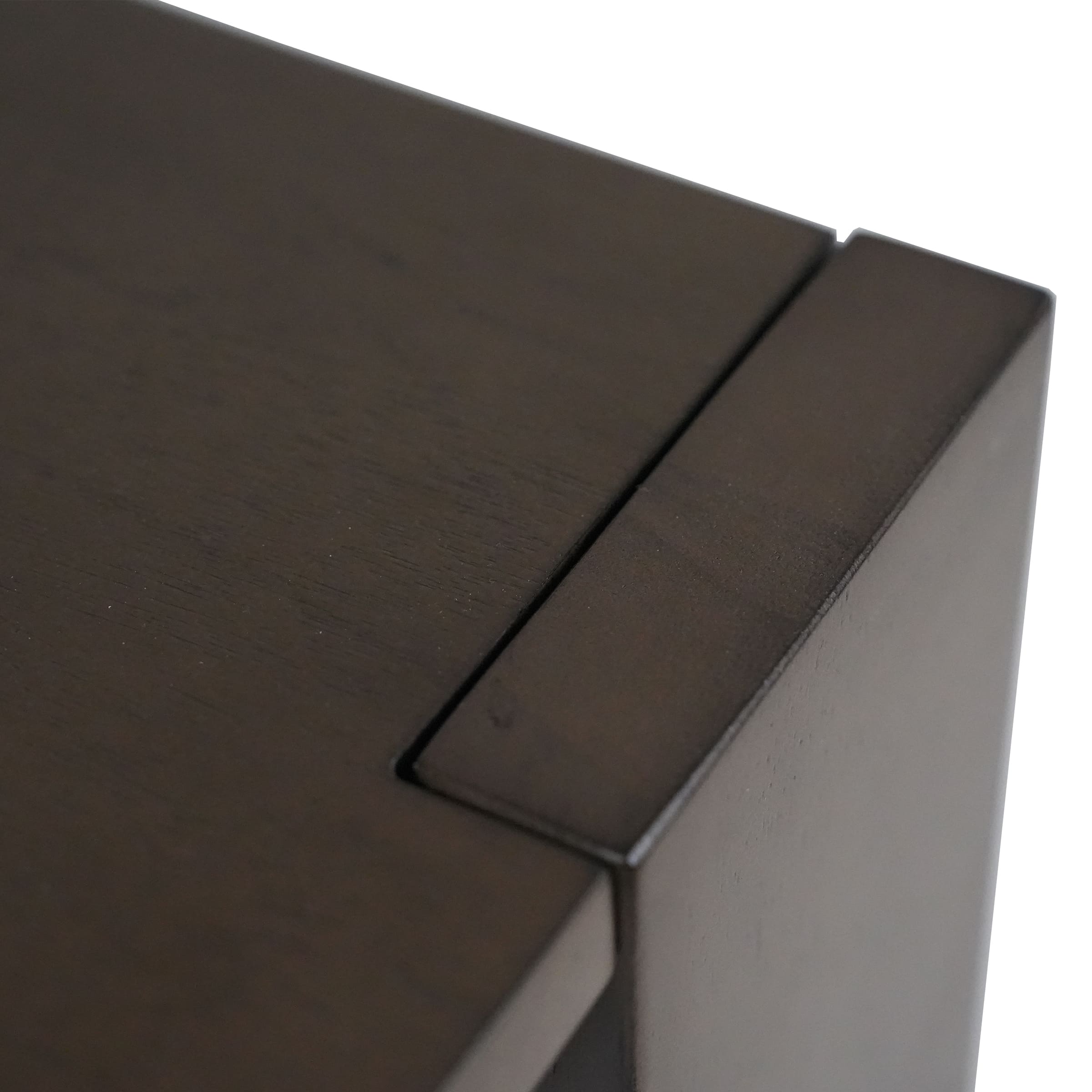 Edge close-up of dark wood finish