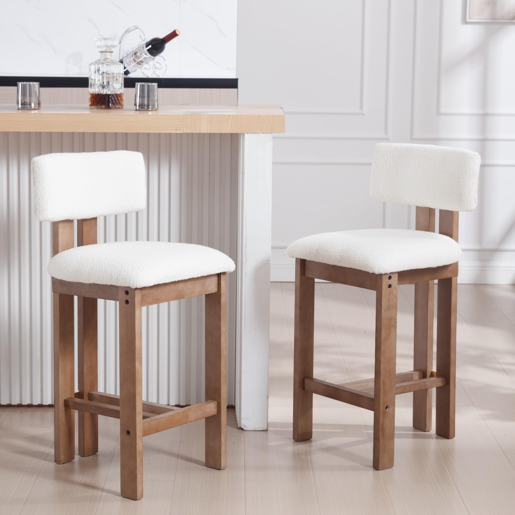 Two stools with white cushions