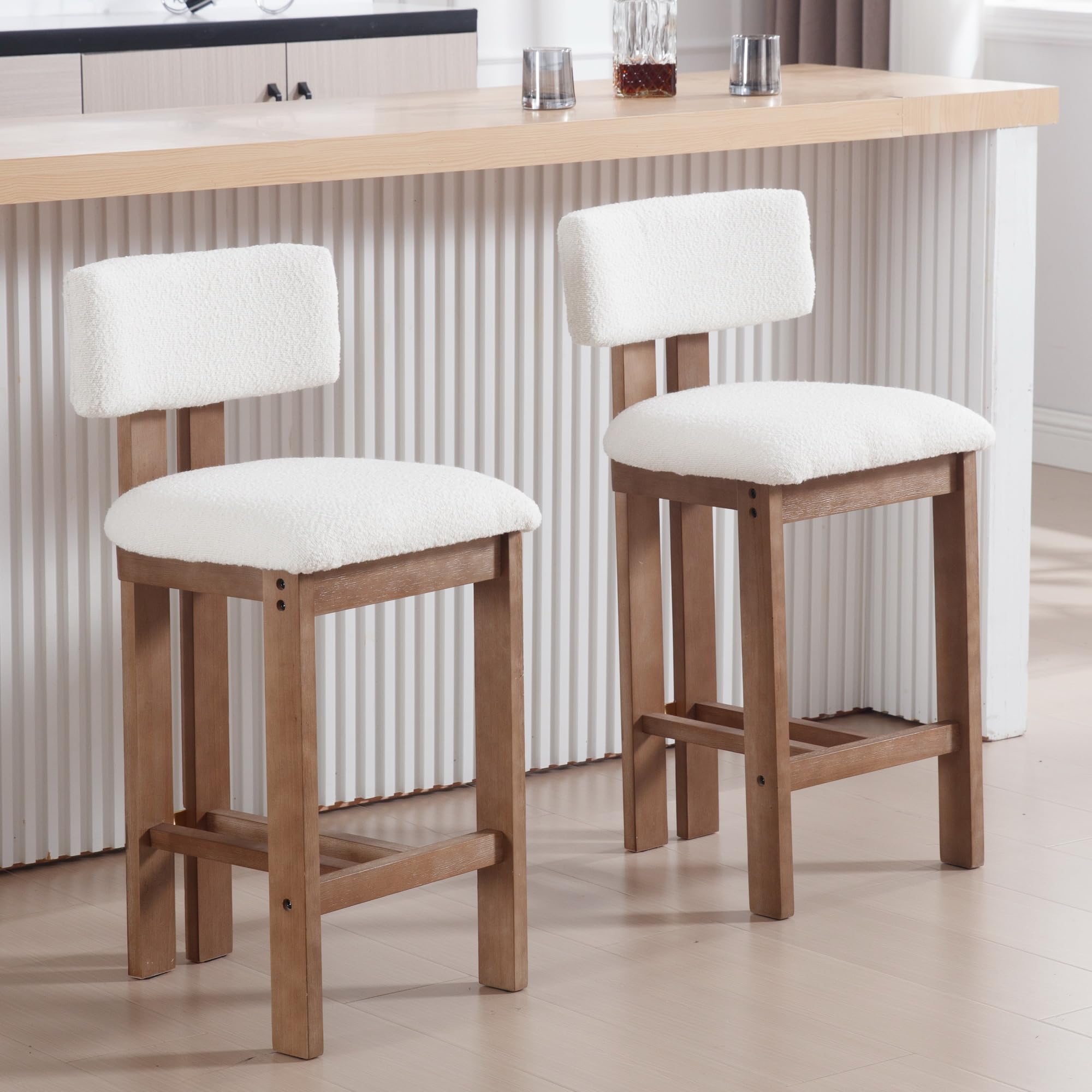 Two stools with white cushions