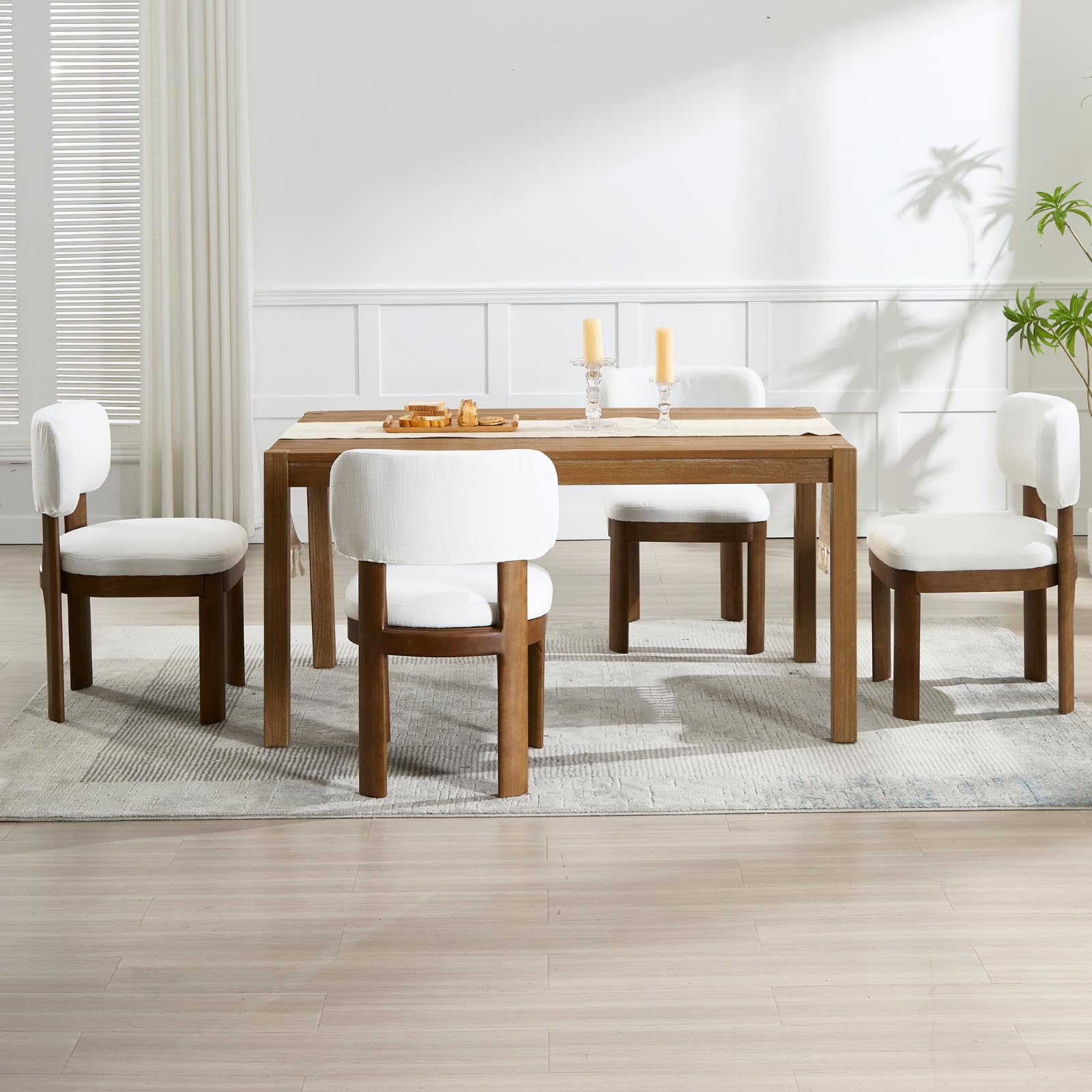 Dining set with two white chairs and two green chairs around table