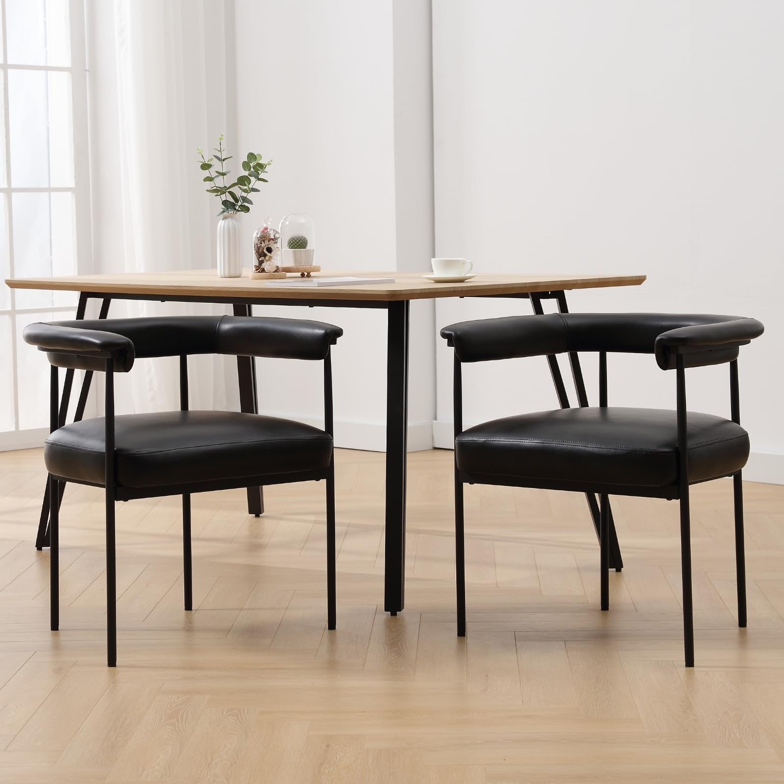 Black chairs around wooden table