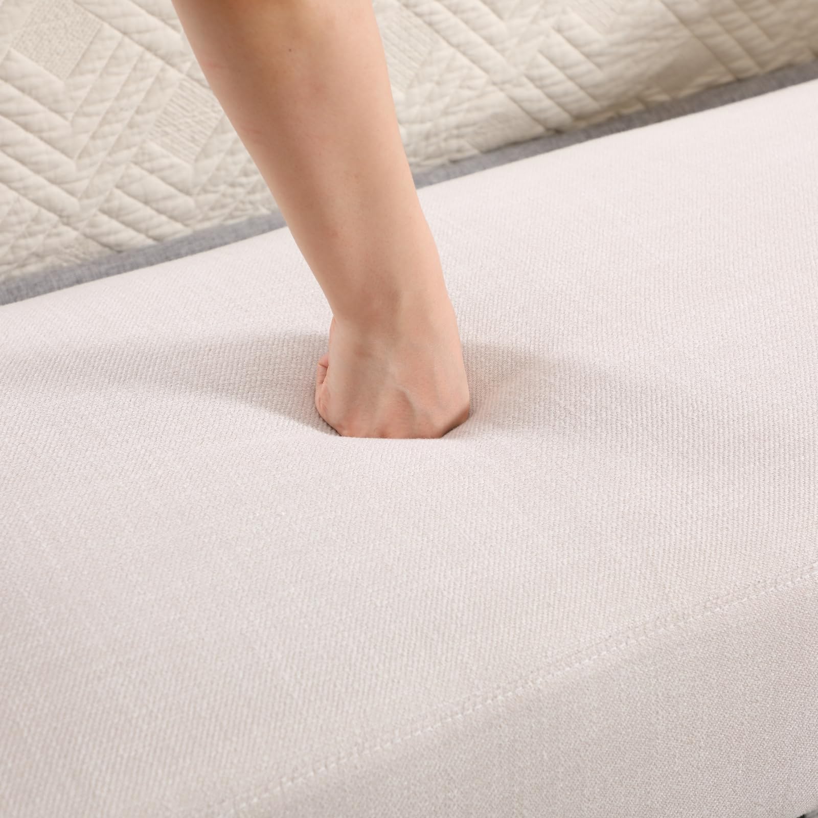 Hand pressing into bench fabric
