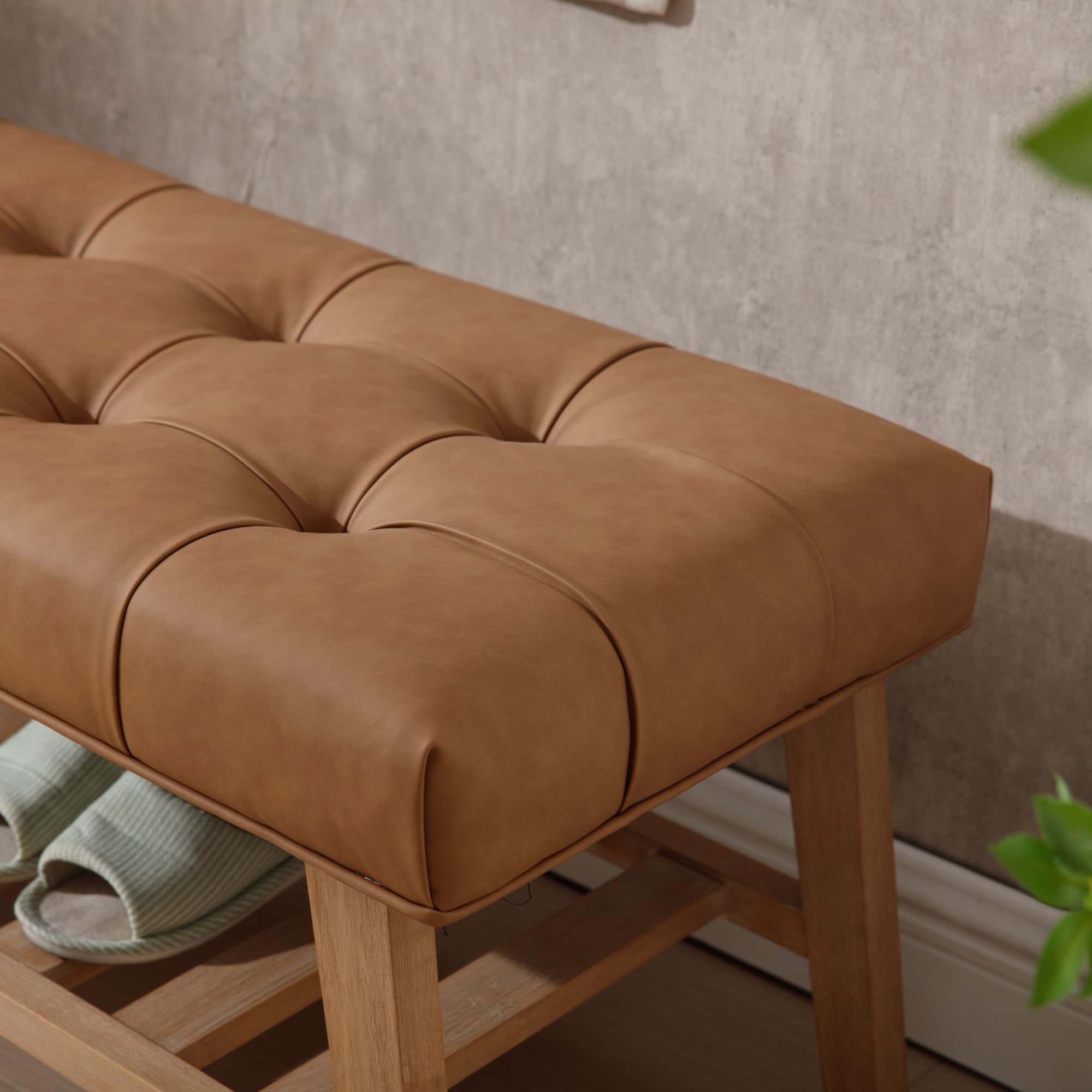 Leather tufted bench close-up