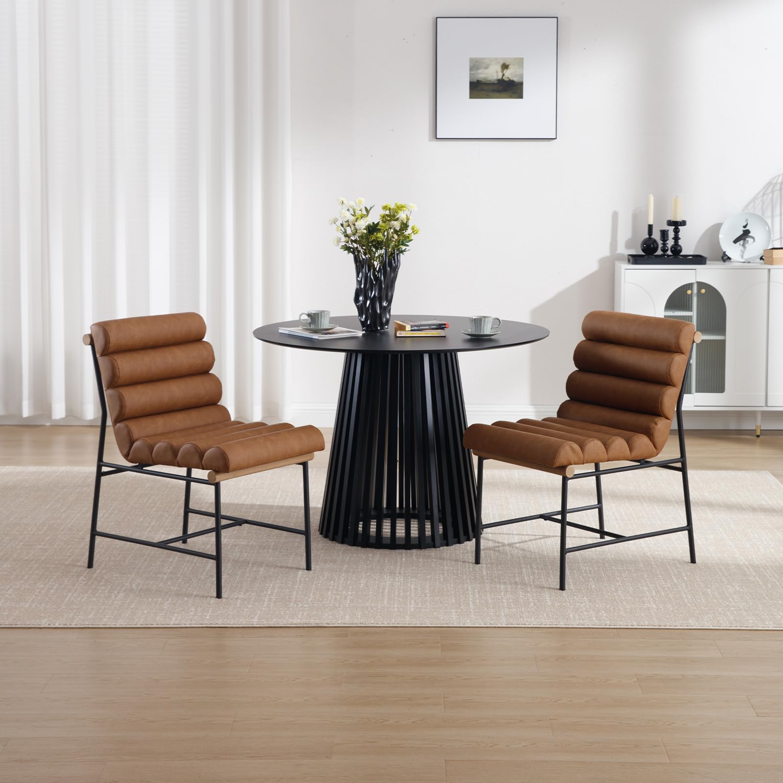 Two chairs with table in living room setting