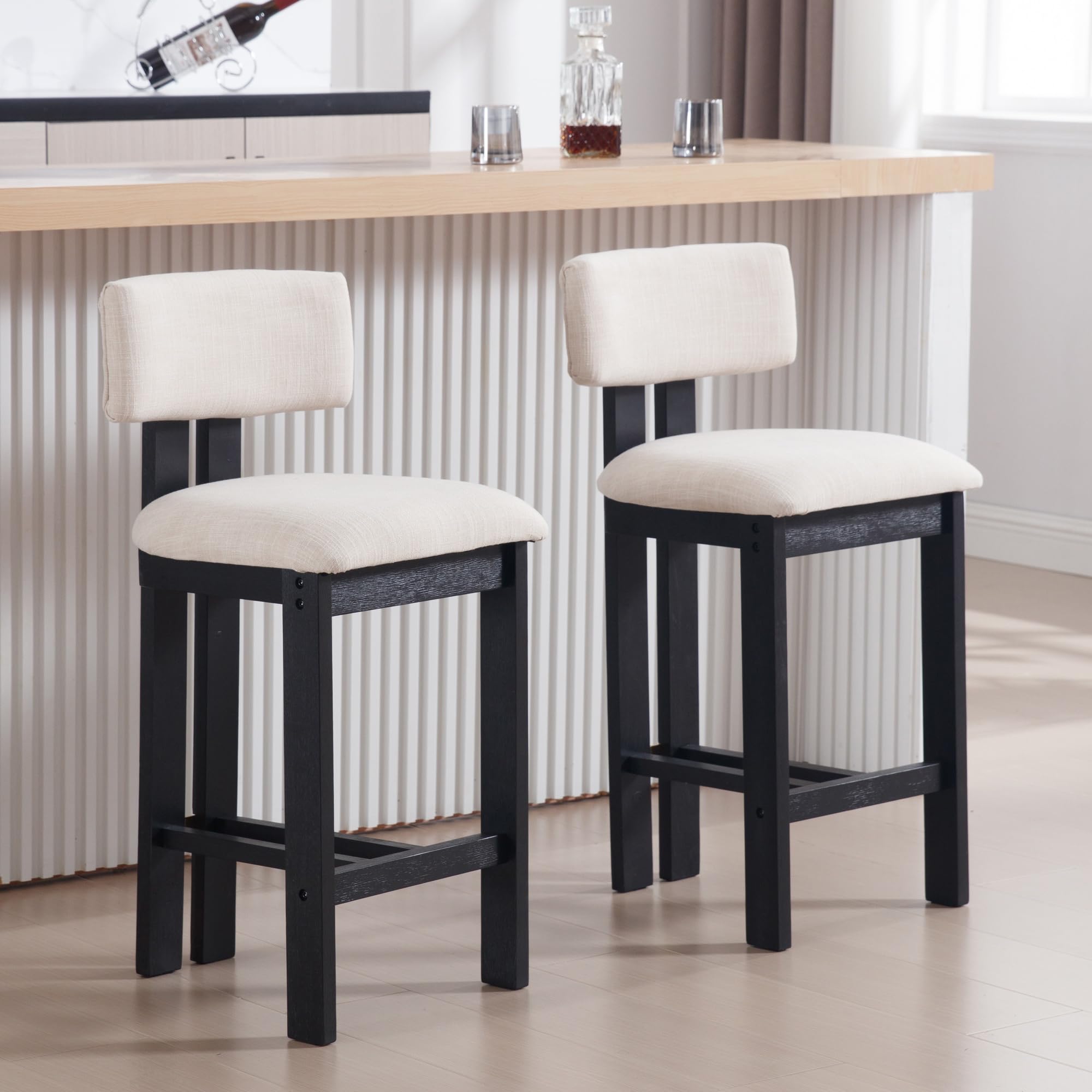 Two black-framed stools at bar