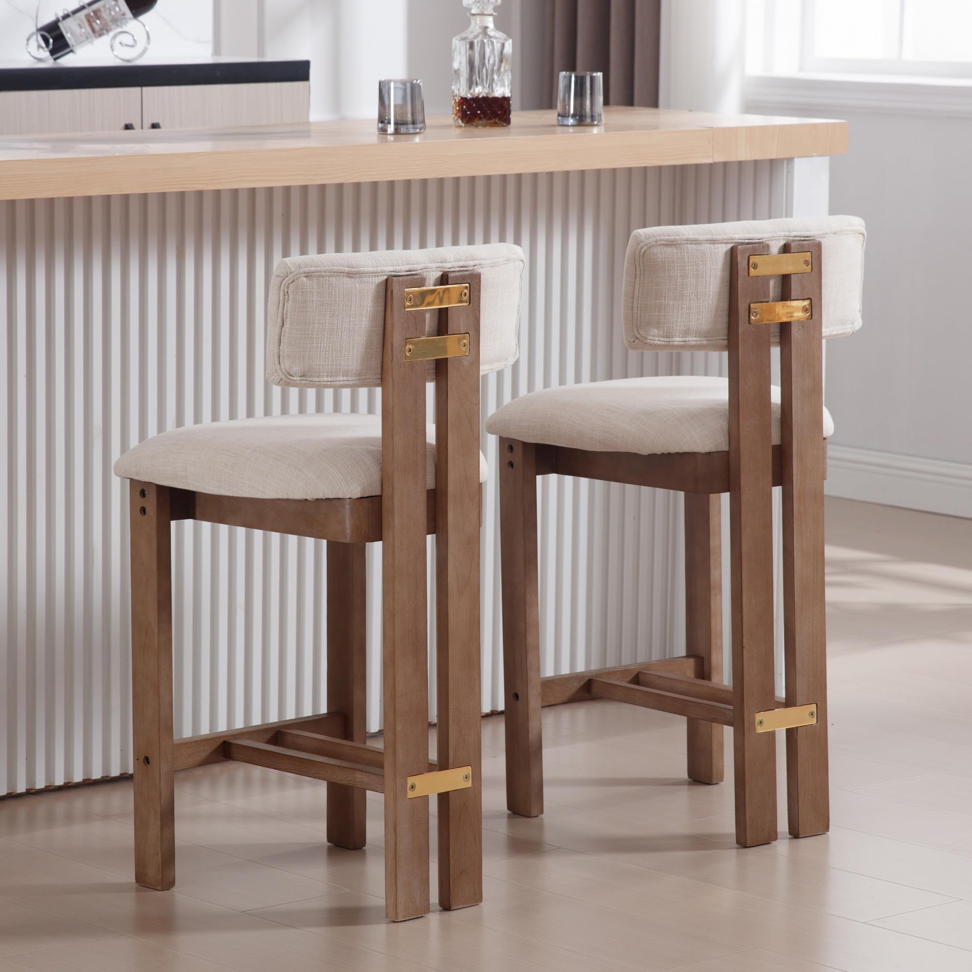 Two stools in a room with white panels