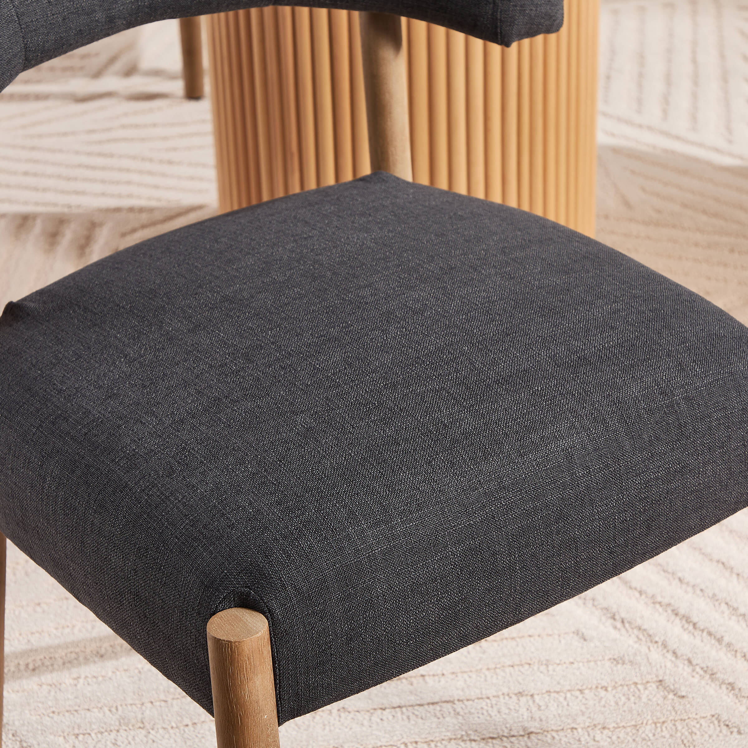 Close-up of chair seat cushion and leg