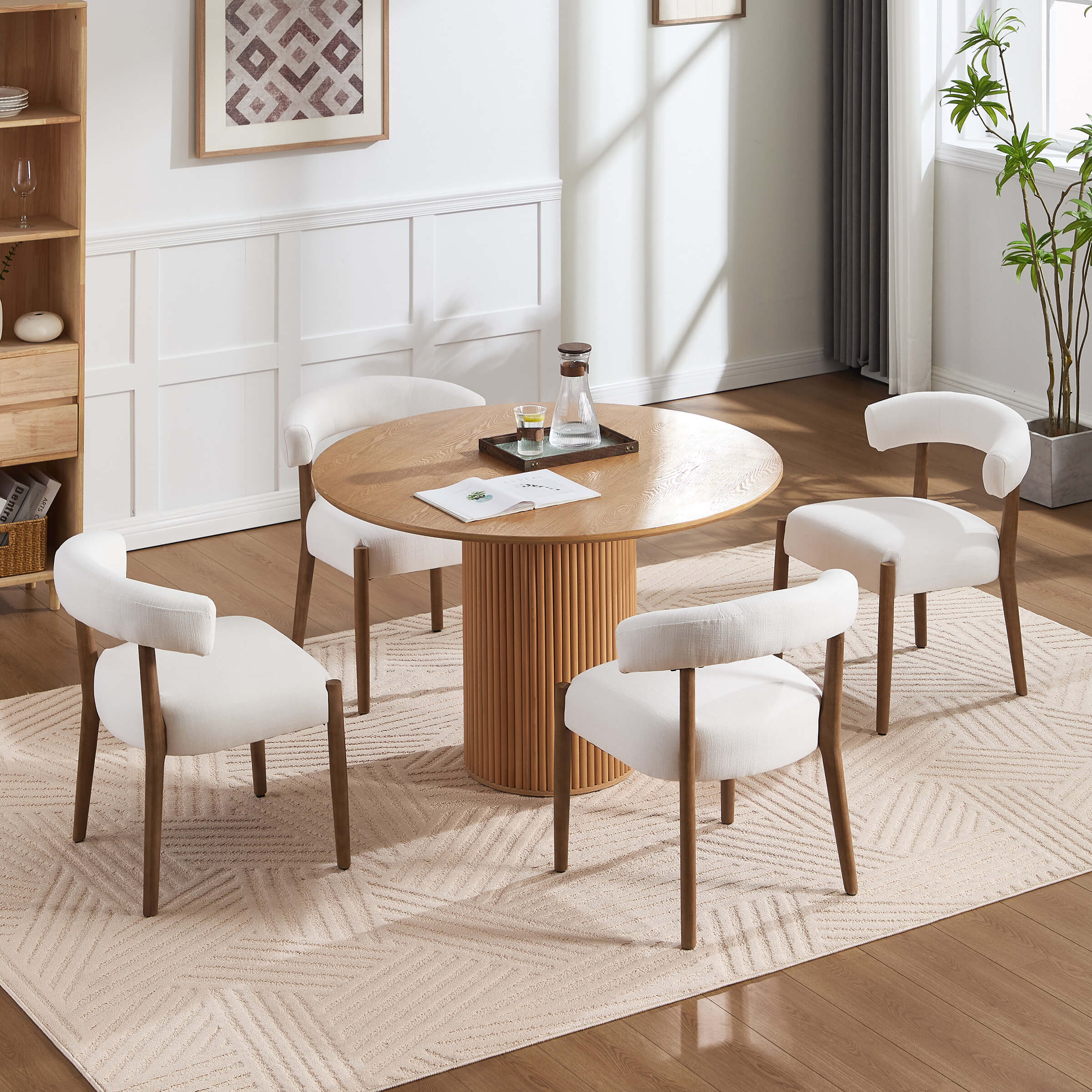 White round table with chairs around it