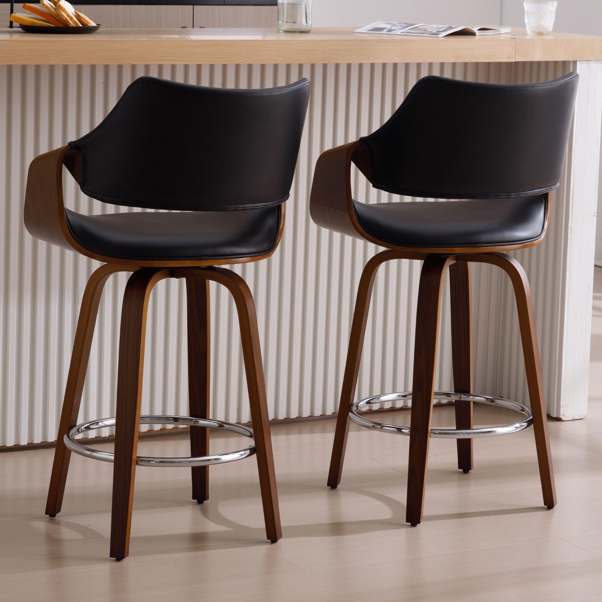 Two black upholstered stools side by side