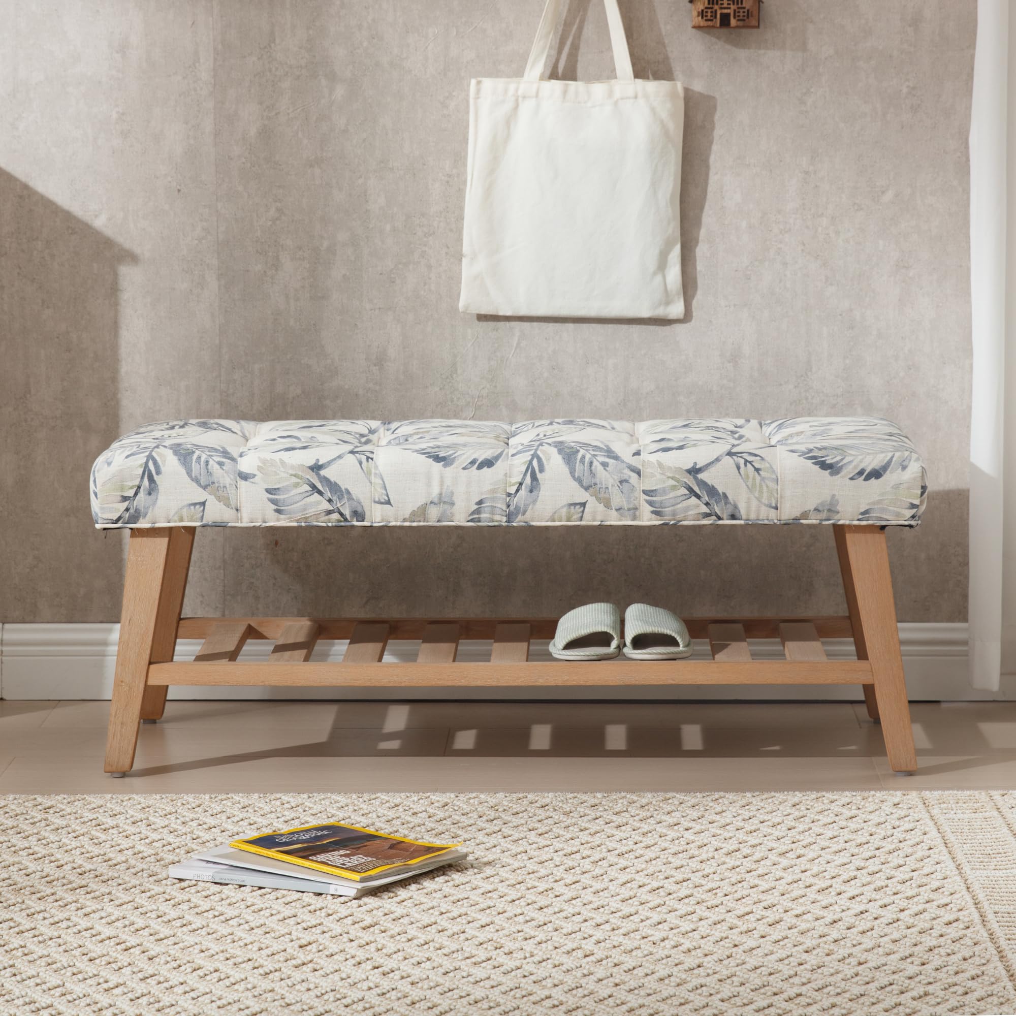 Bench with white cushion in room