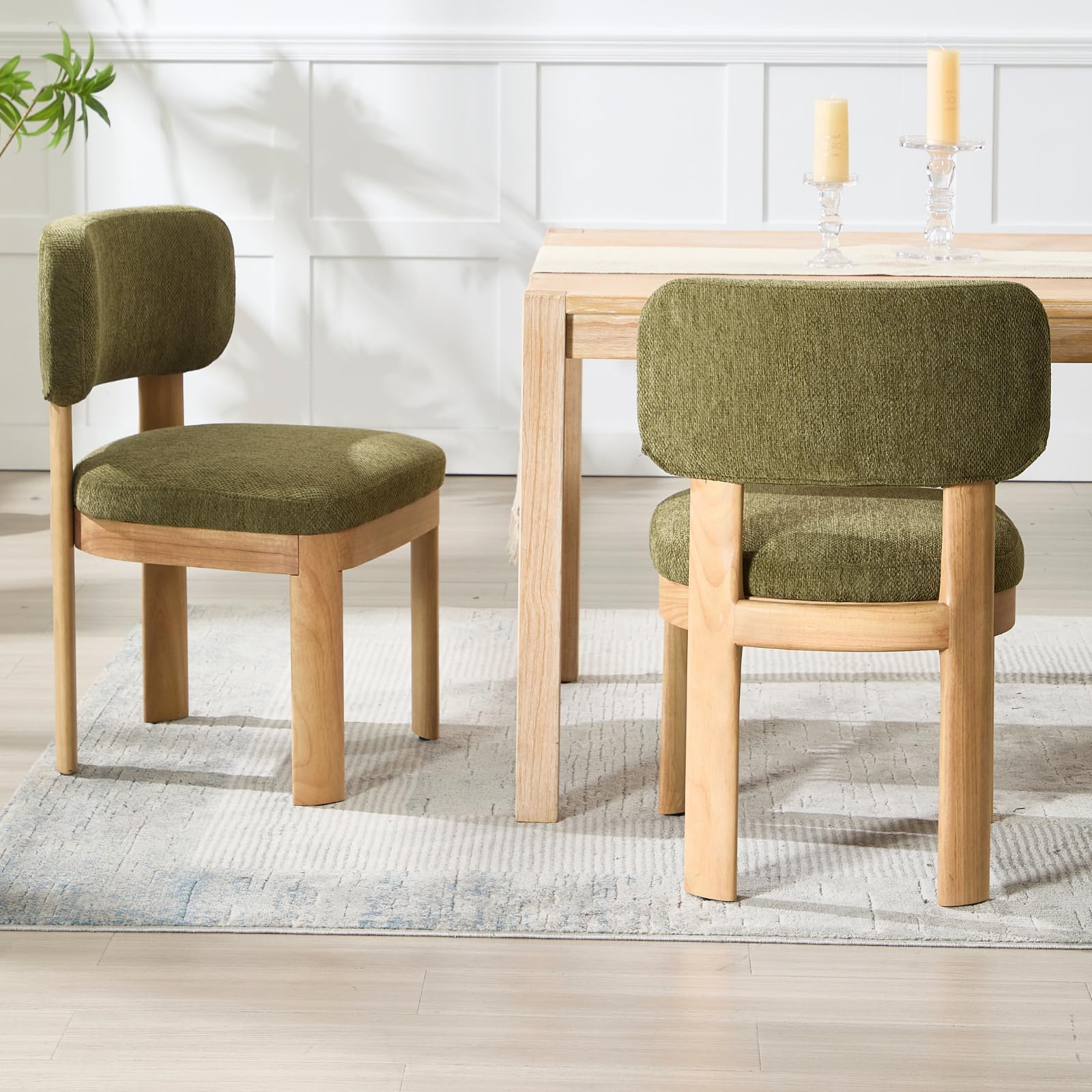 Green and brown chairs around table in room