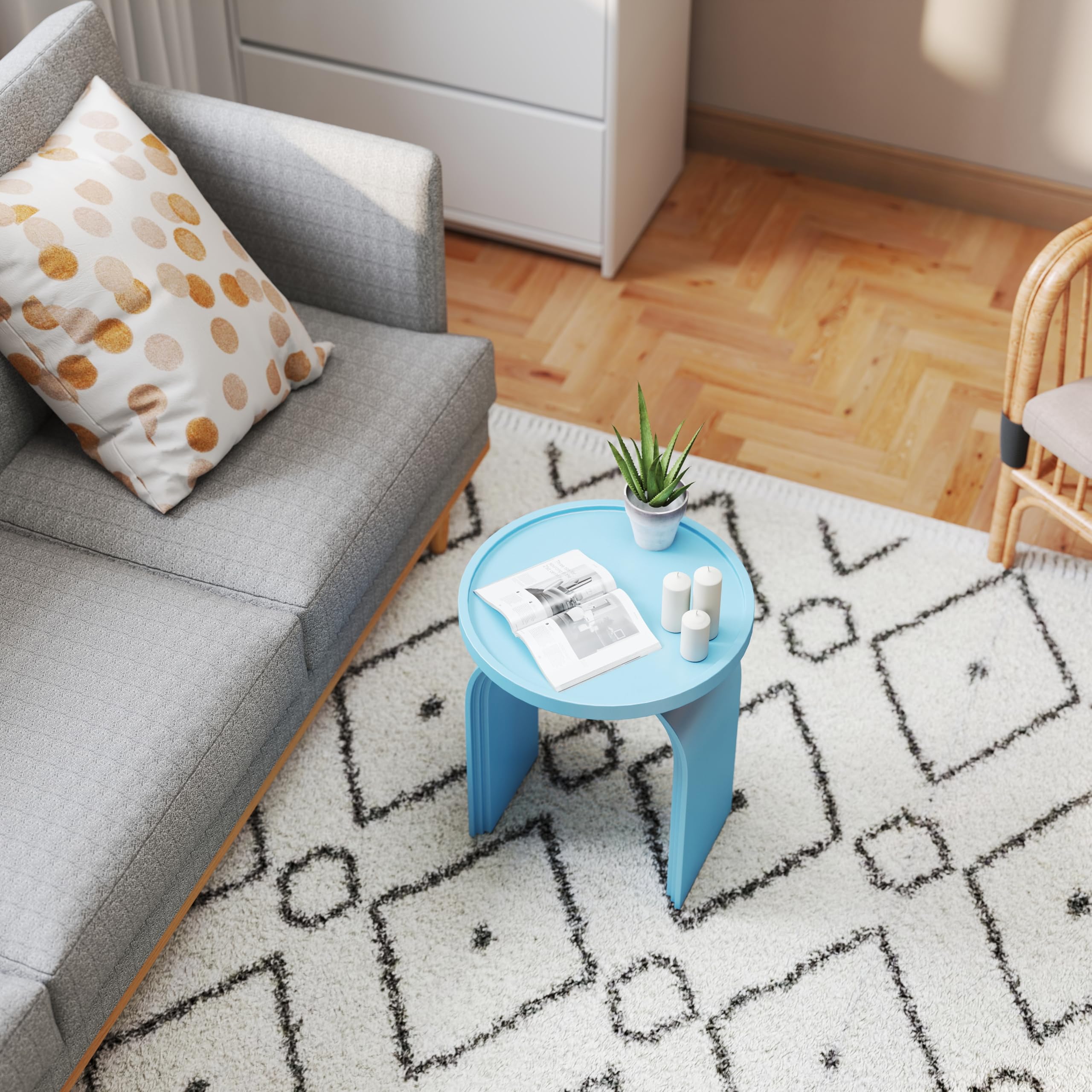 Blue round side table on rug