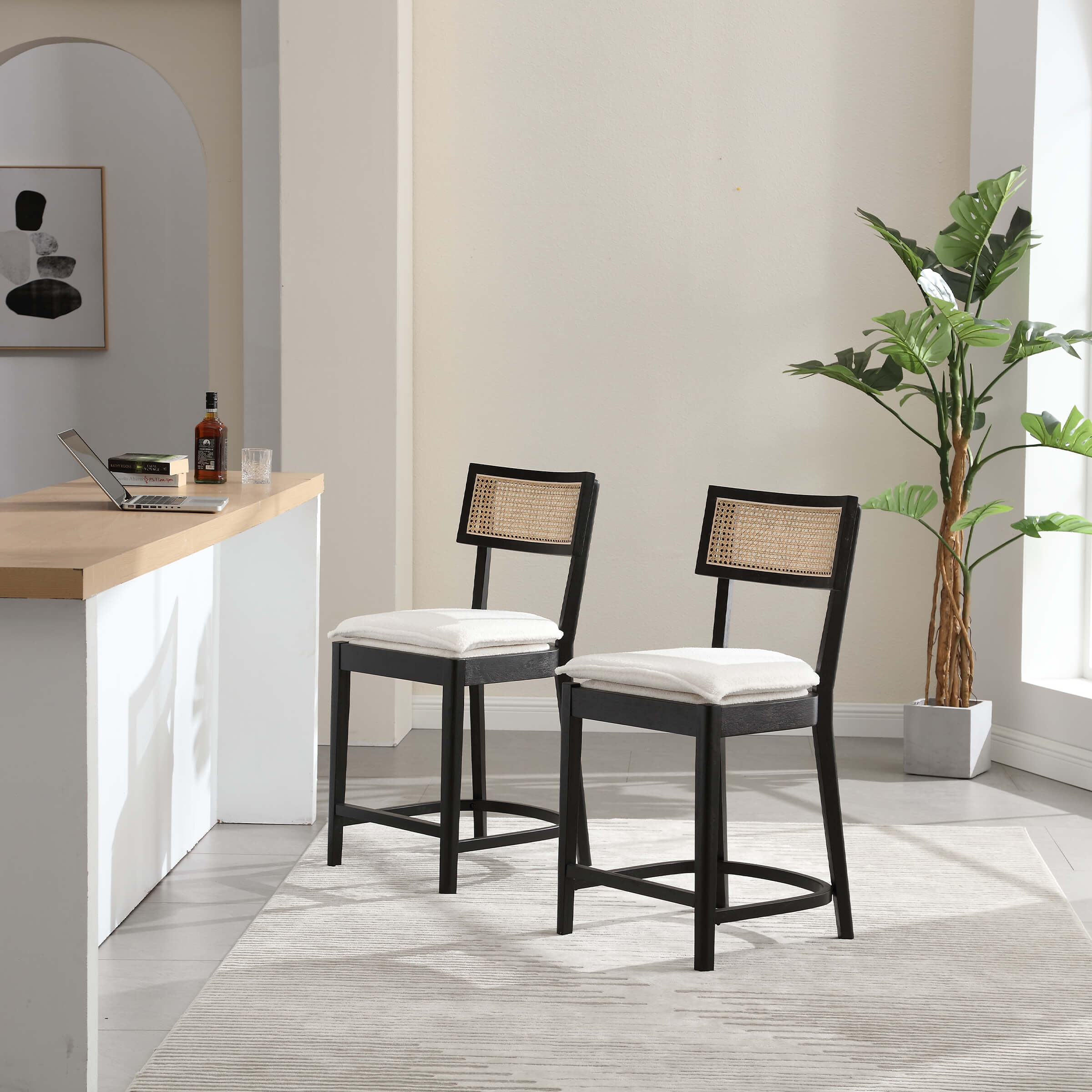 Two light wood stools near bar