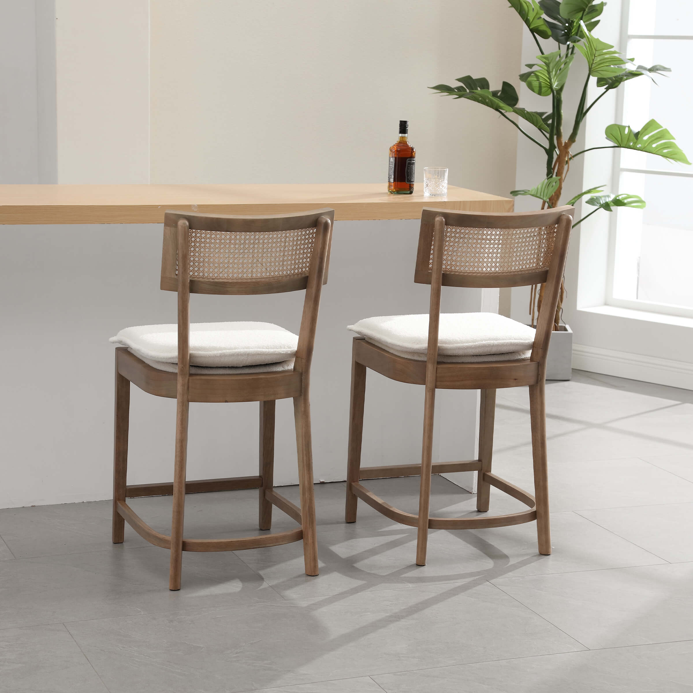 Two black stools with light beige wood
