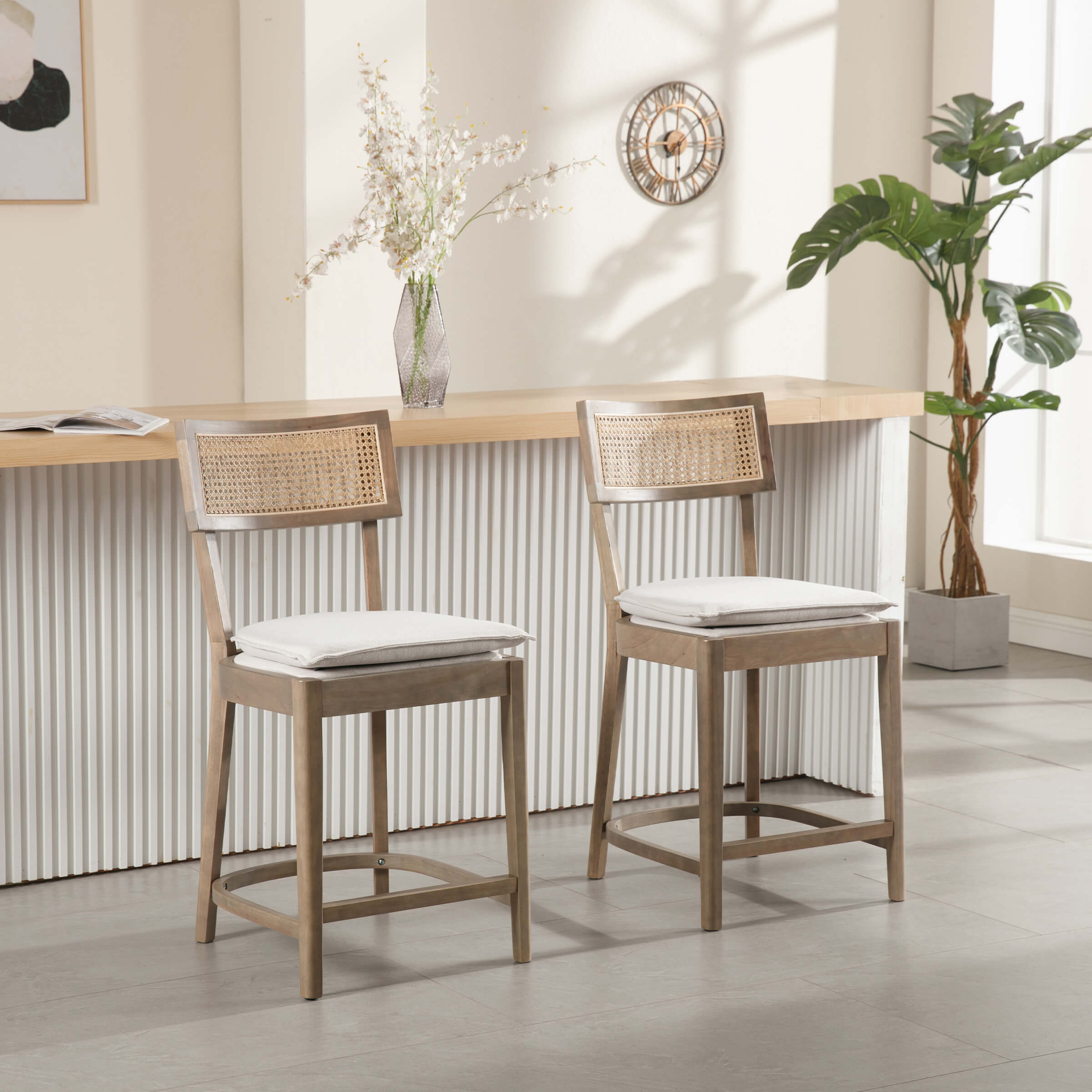 Two stools at bar with same cane-back design