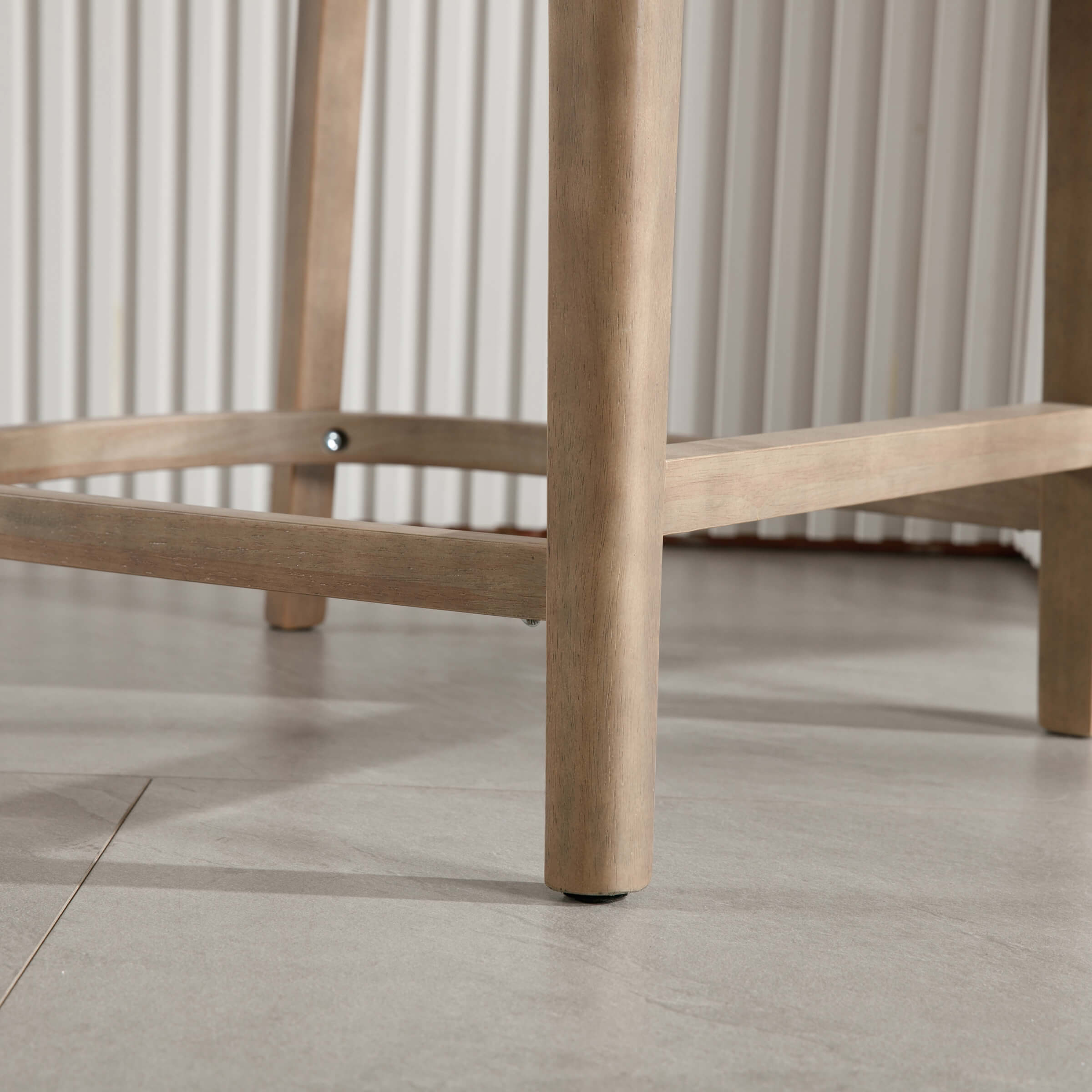 Stool leg and bottom foot near floor