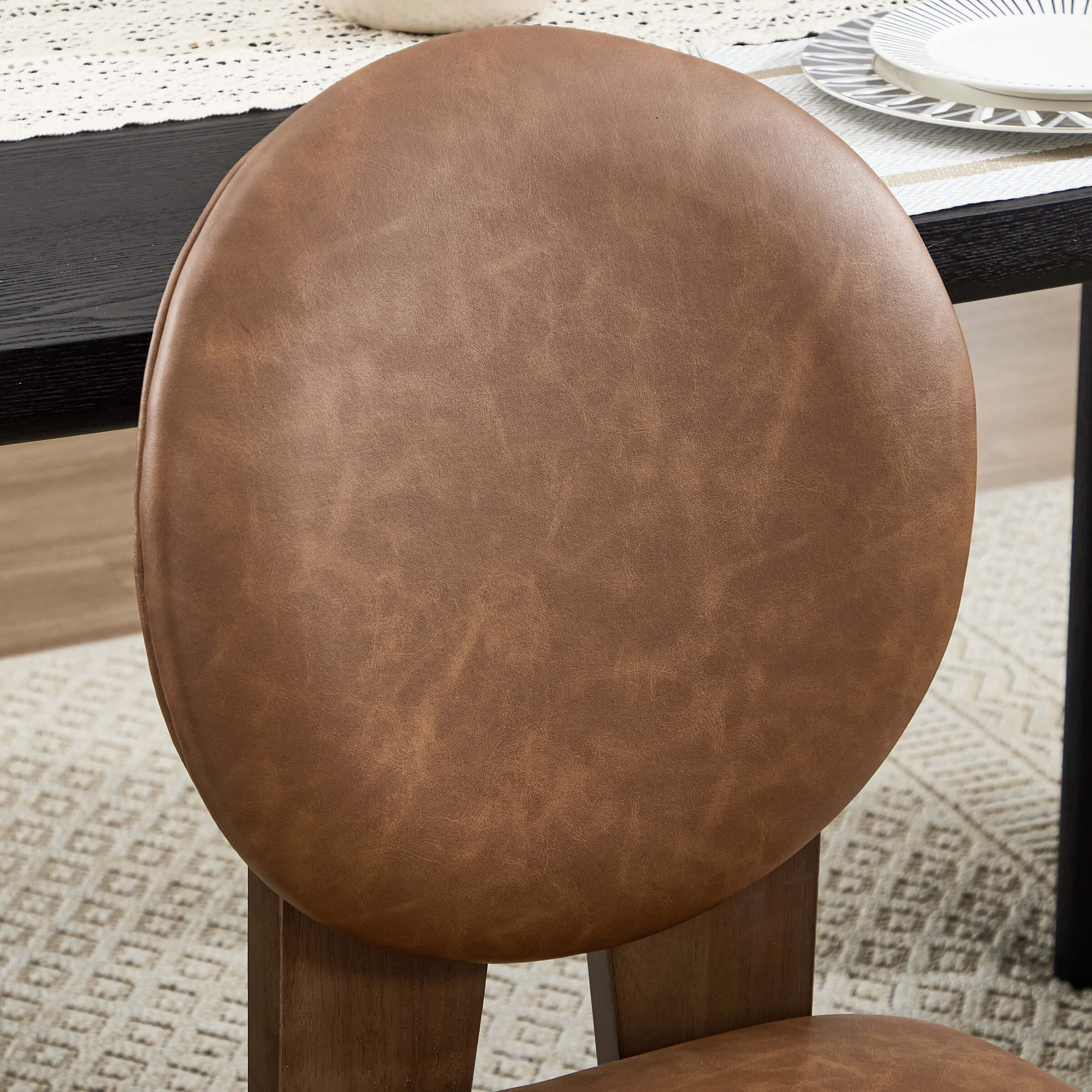 Brown leather chair cushion close-up