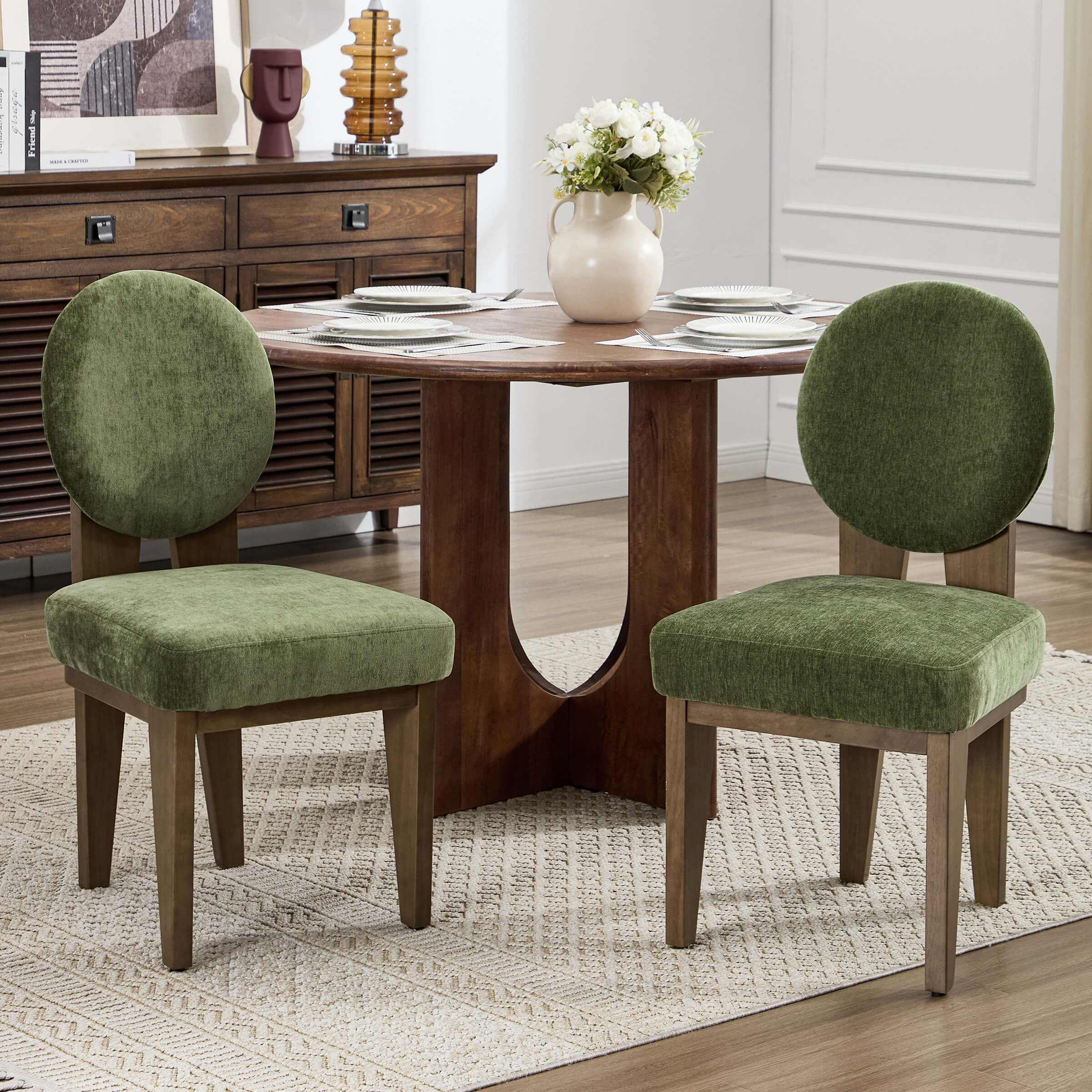 Chairs with green upholstery around a table