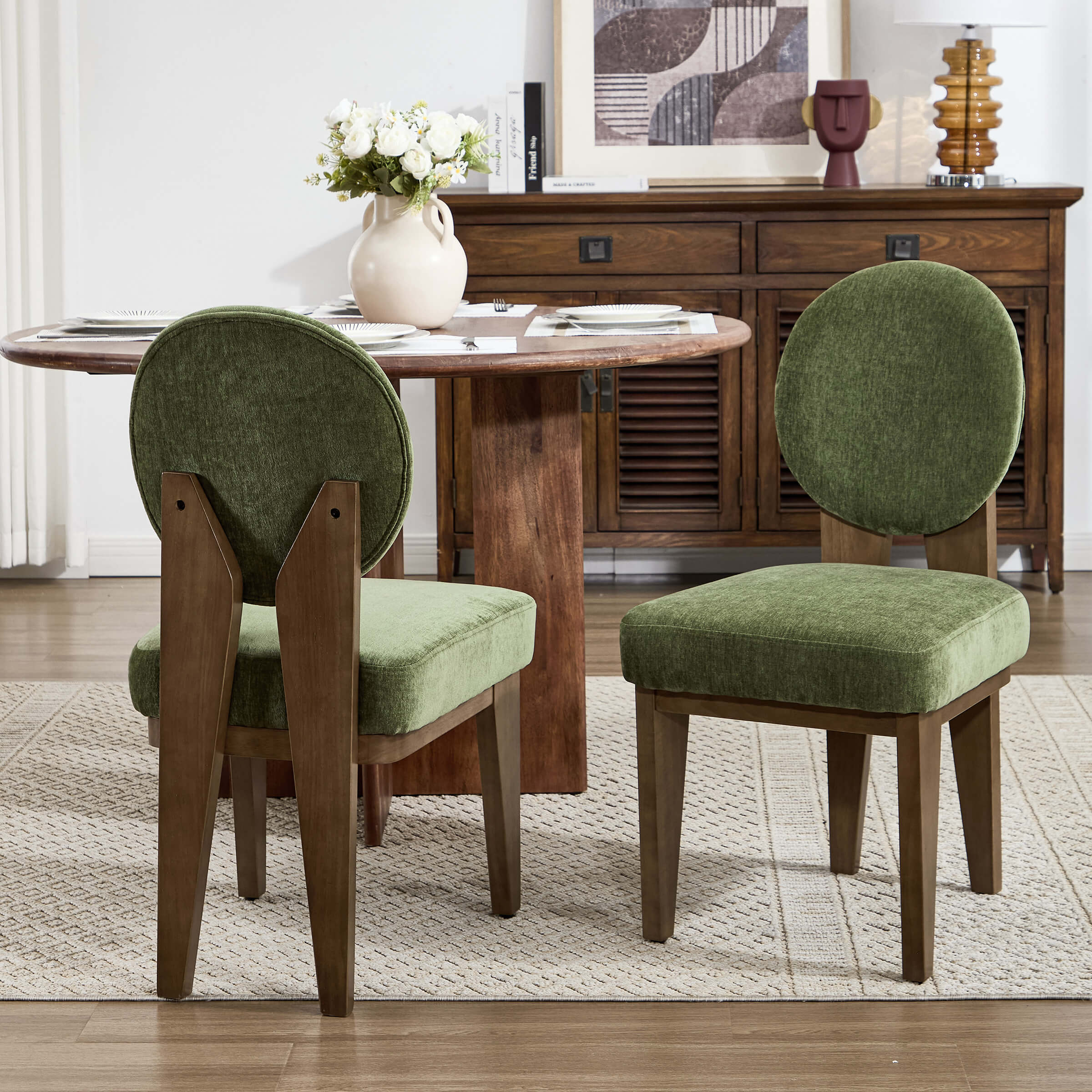 Green upholstered chairs around a table