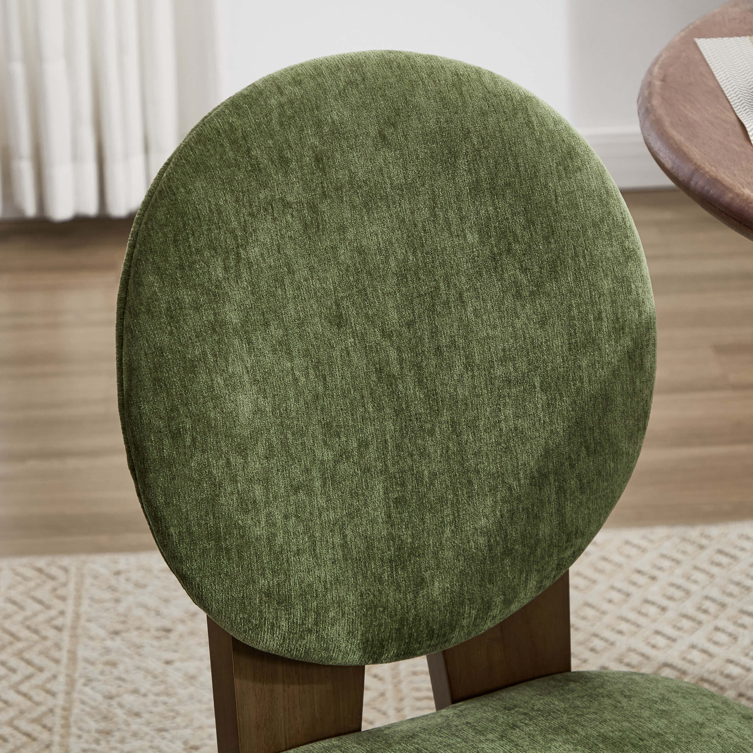 Green fabric upholstery close-up on chair back