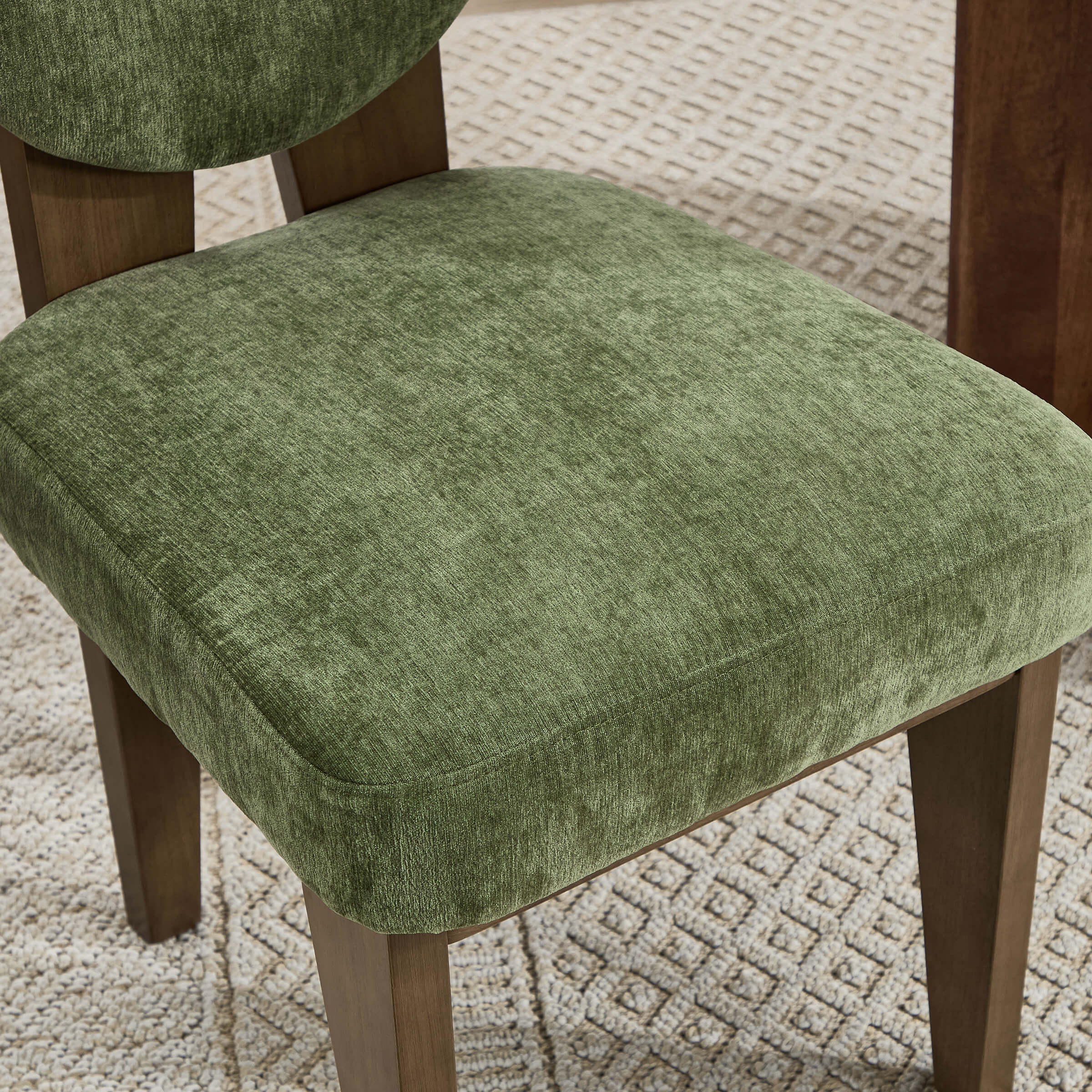 Green upholstery close-up on chair seat