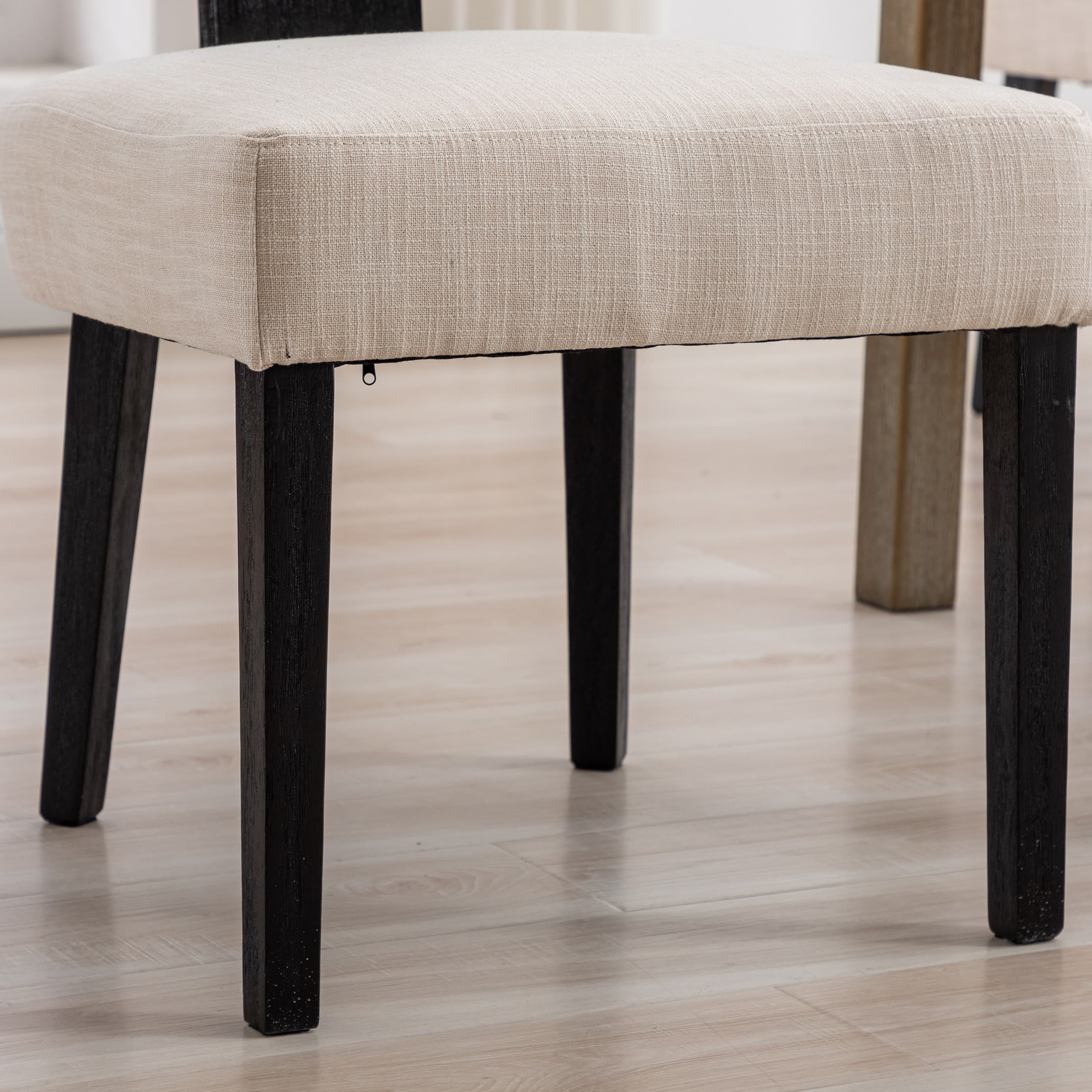 Side view of chair with beige seat
