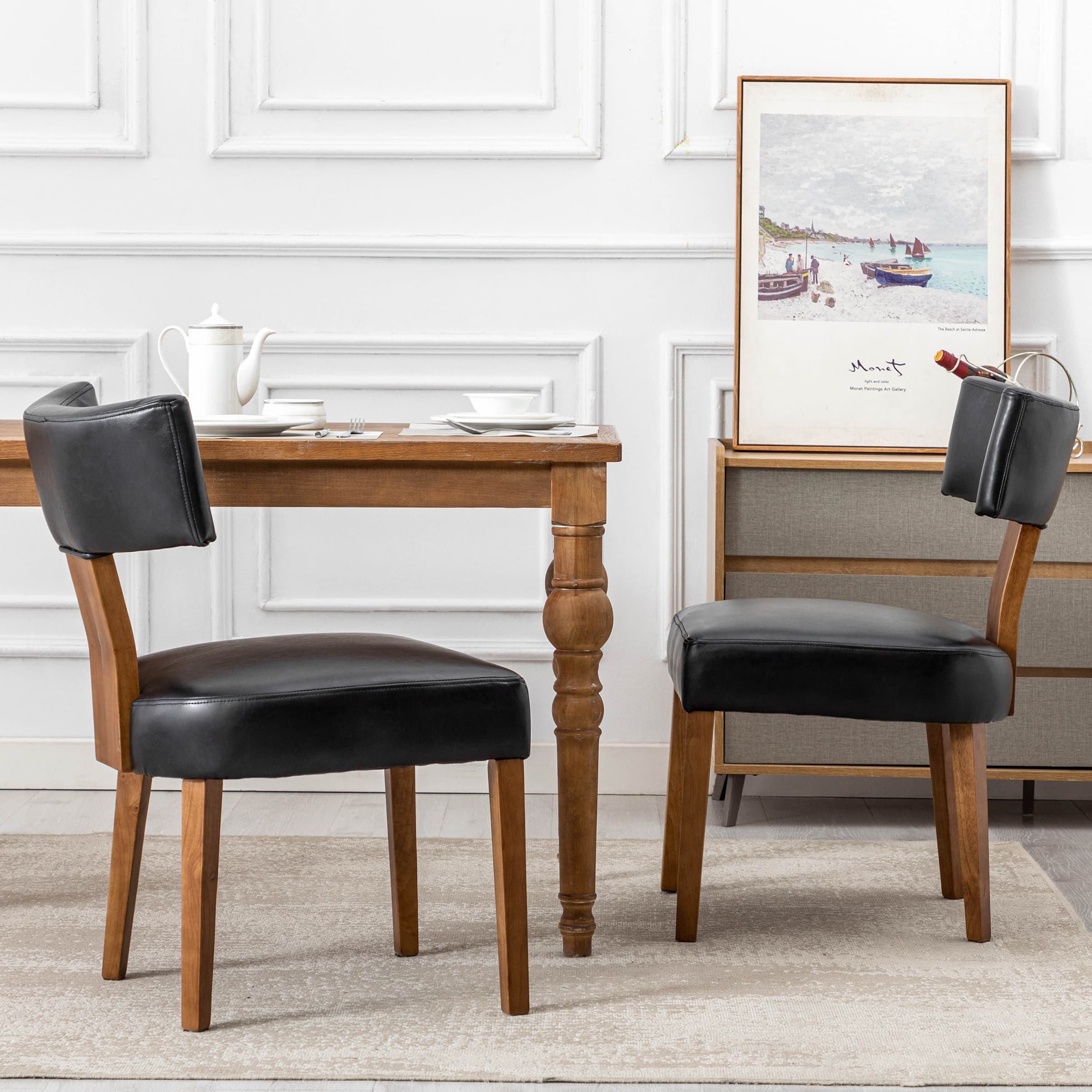 Two chairs and table in white room