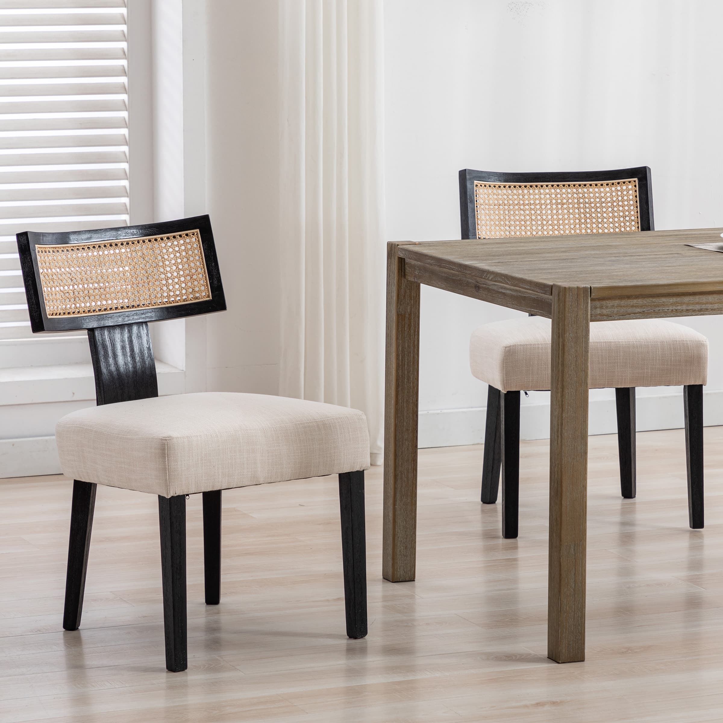 Close view of dining chair with caned back and beige seat