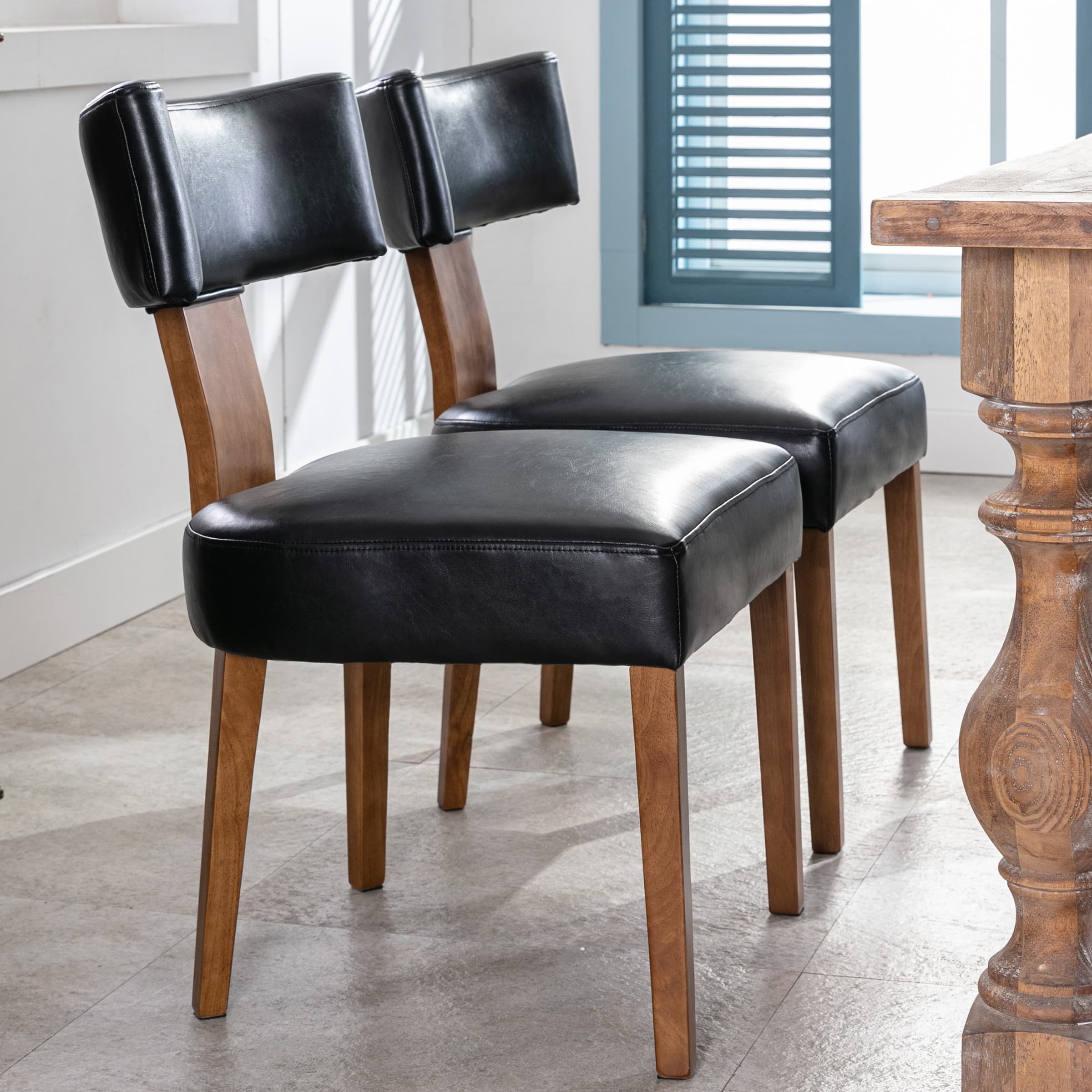 Two caned-back chairs