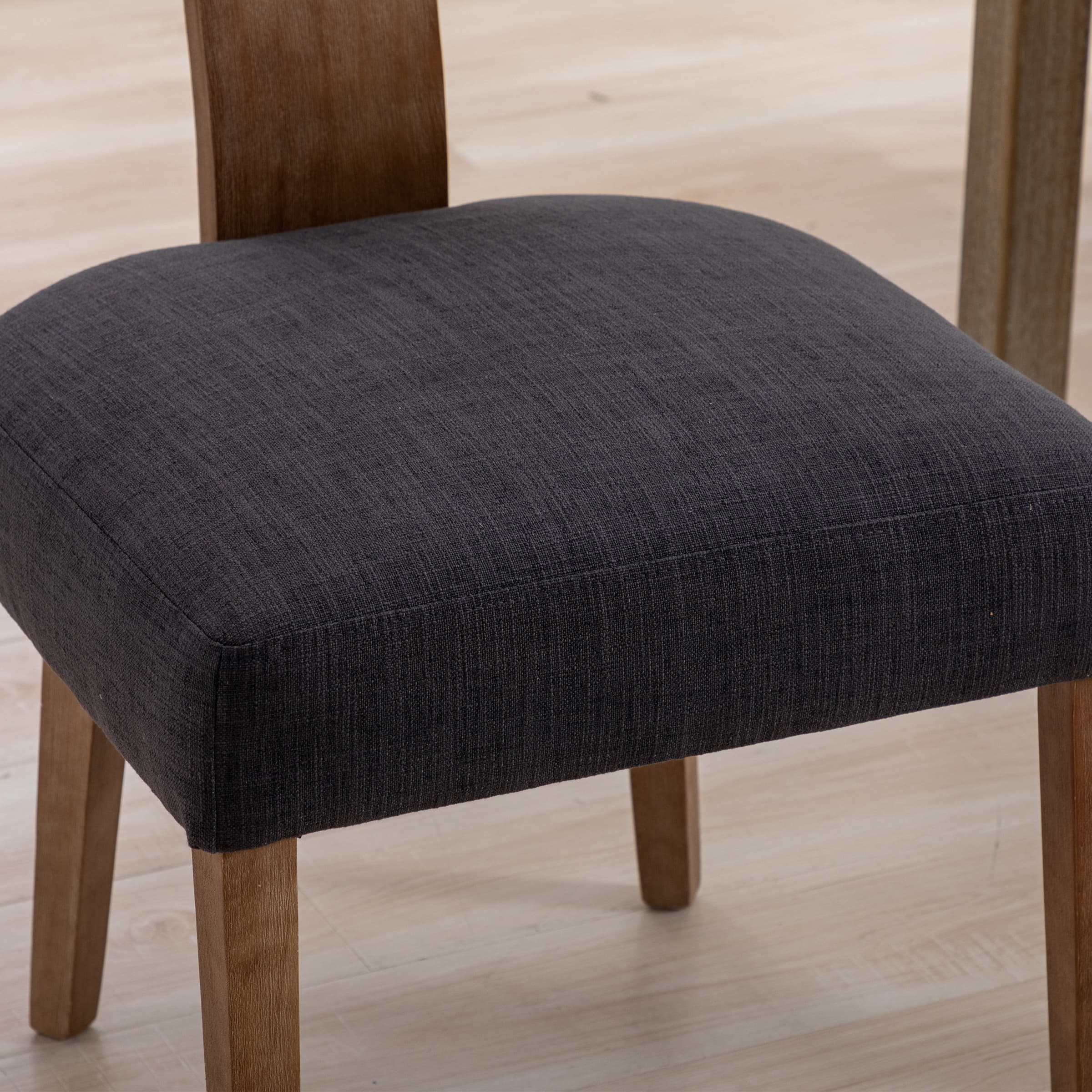 Close-up of chair legs and upholstery