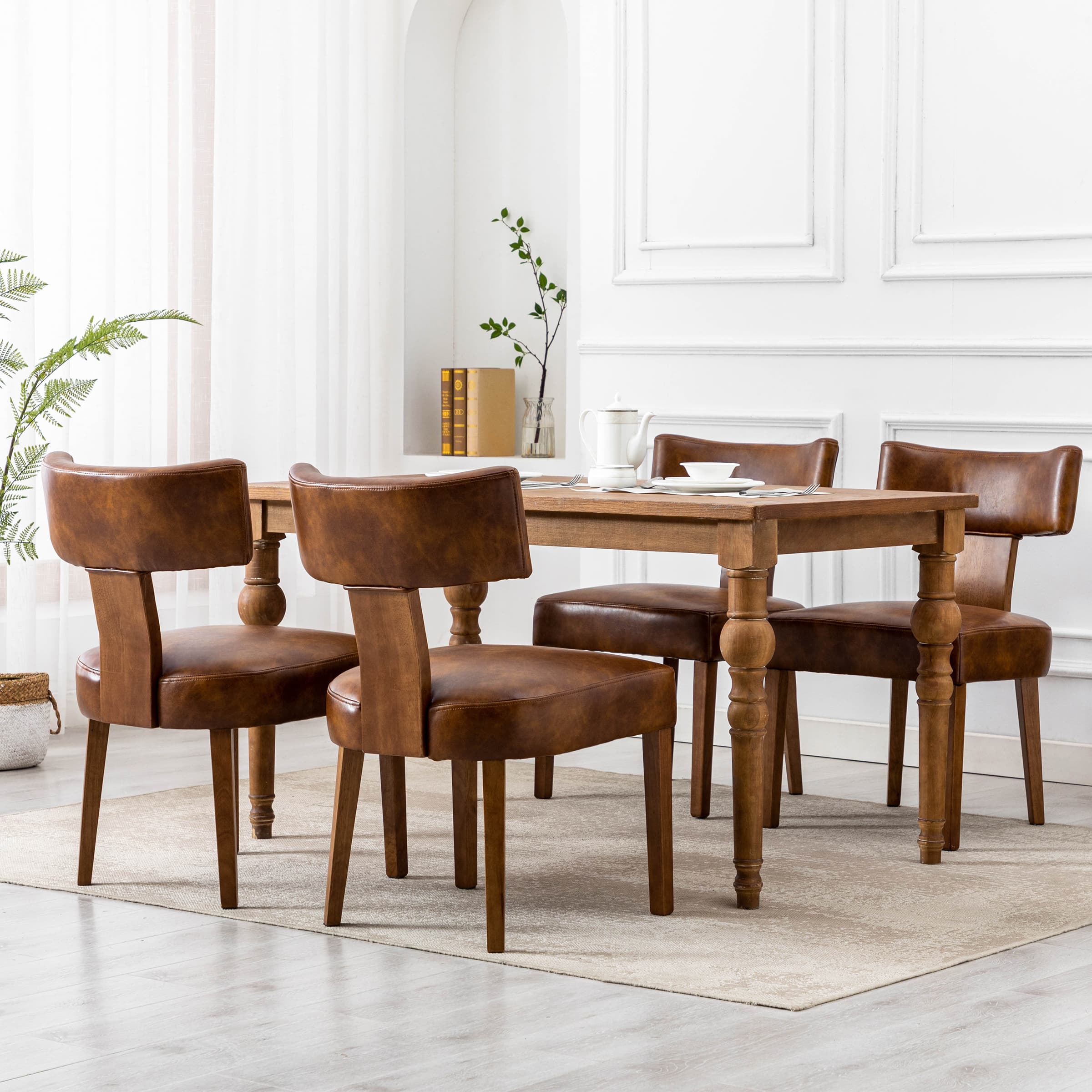 Chairs around table in white room