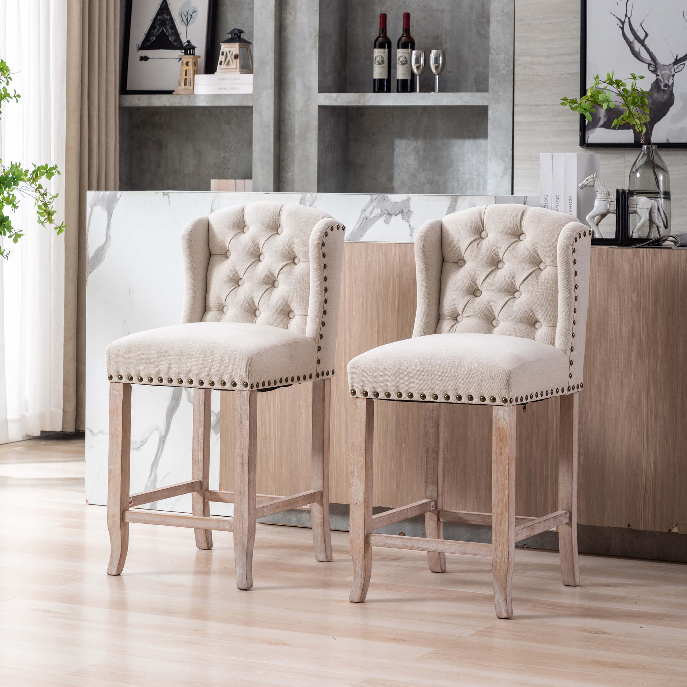 Two beige tufted bar stools at kitchen island