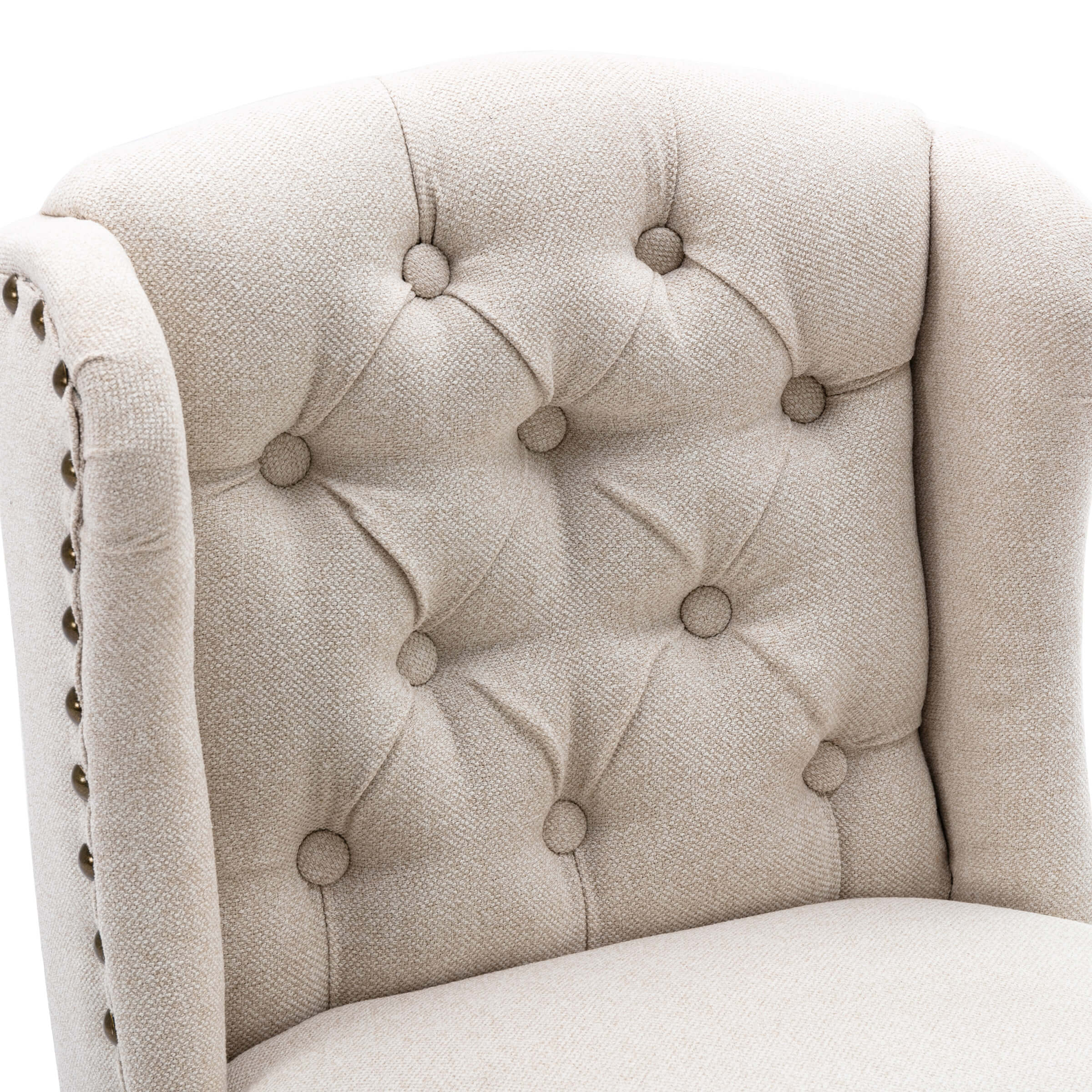 Close-up of beige upholstered tufted back with buttons