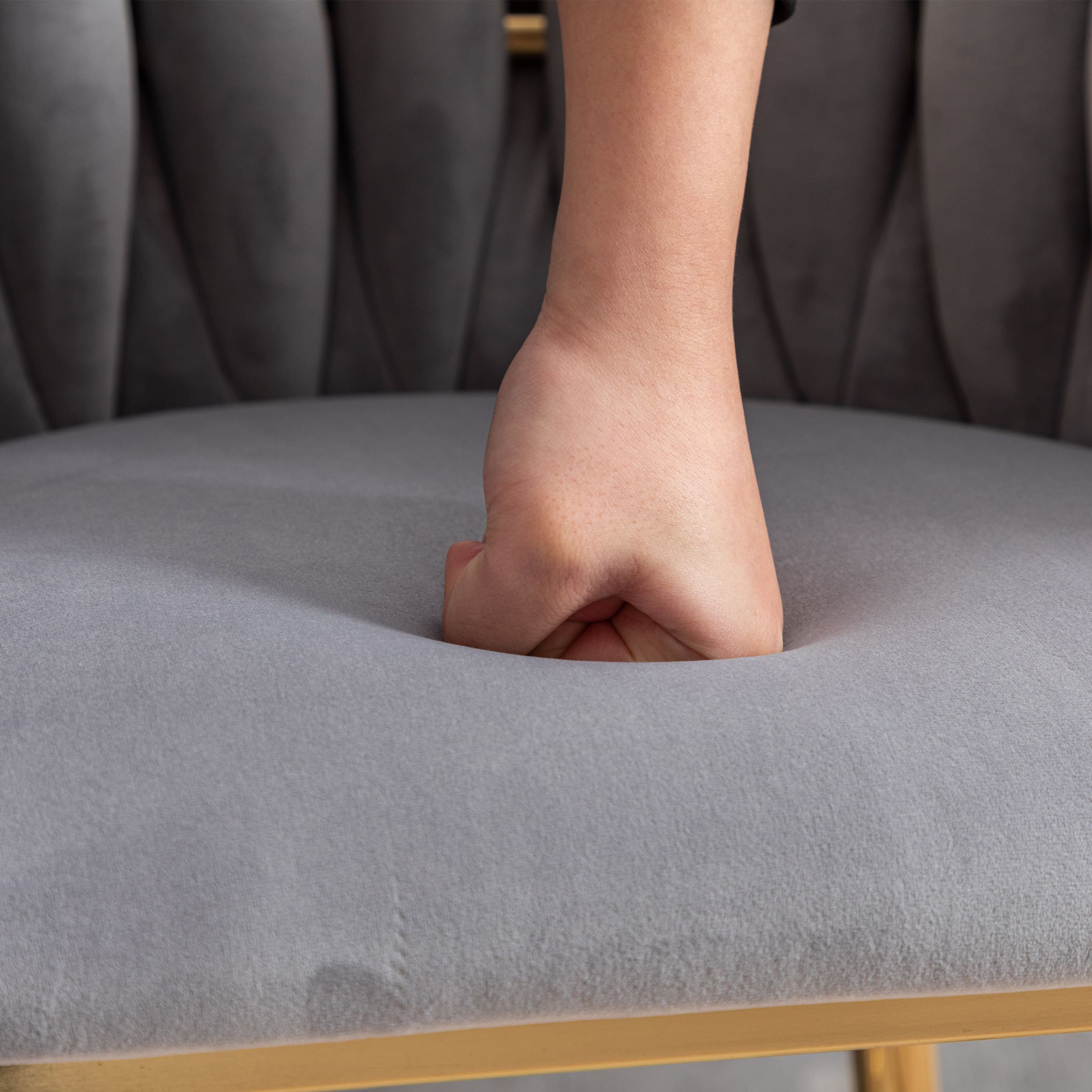 Hand pressing into upholstery