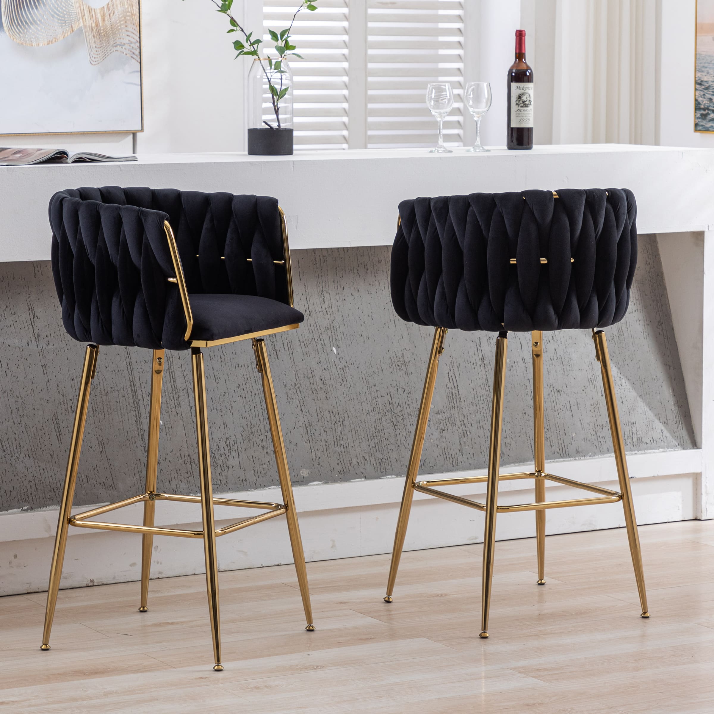 Two stools with dark upholstery from different angle