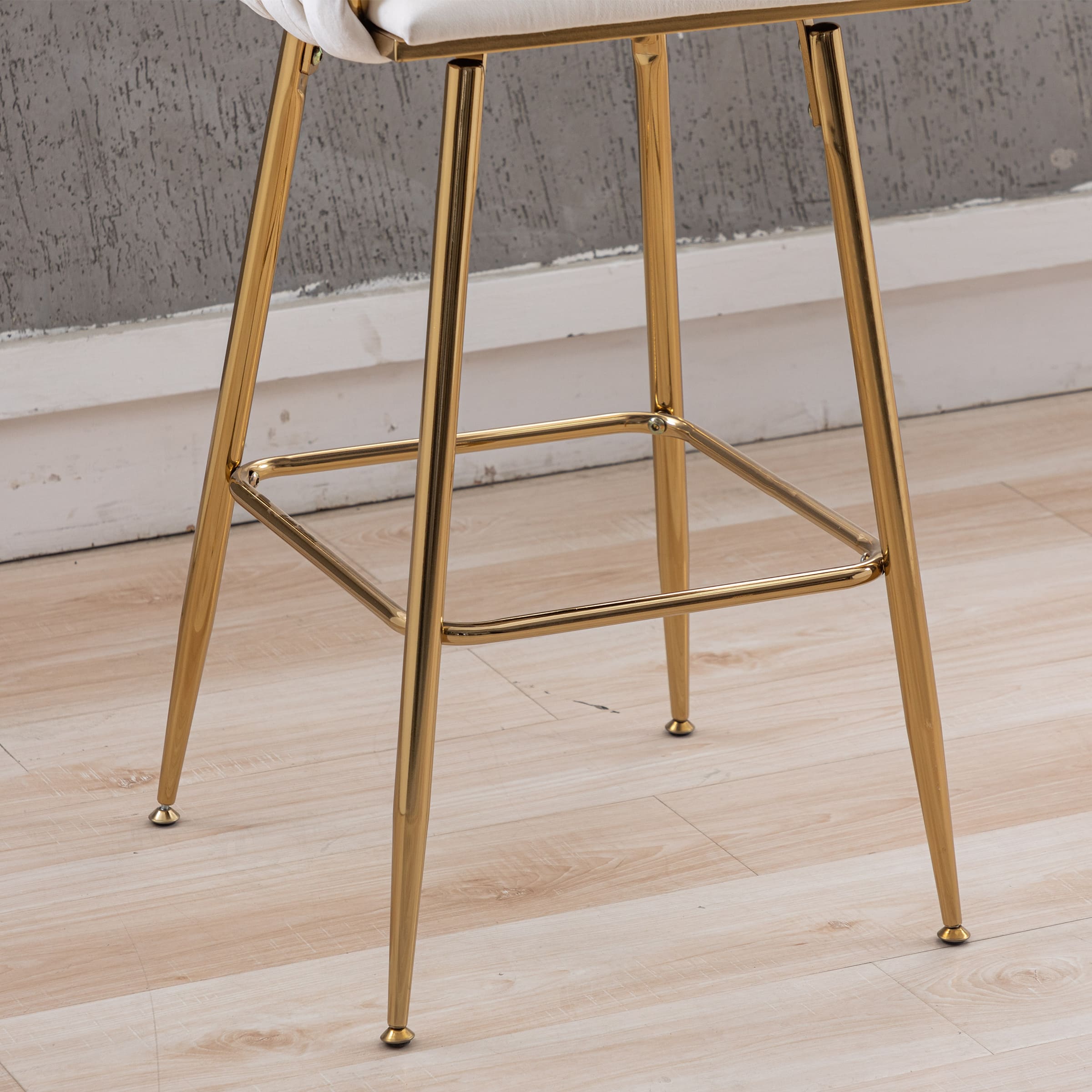 Close-up of stool legs and footrest