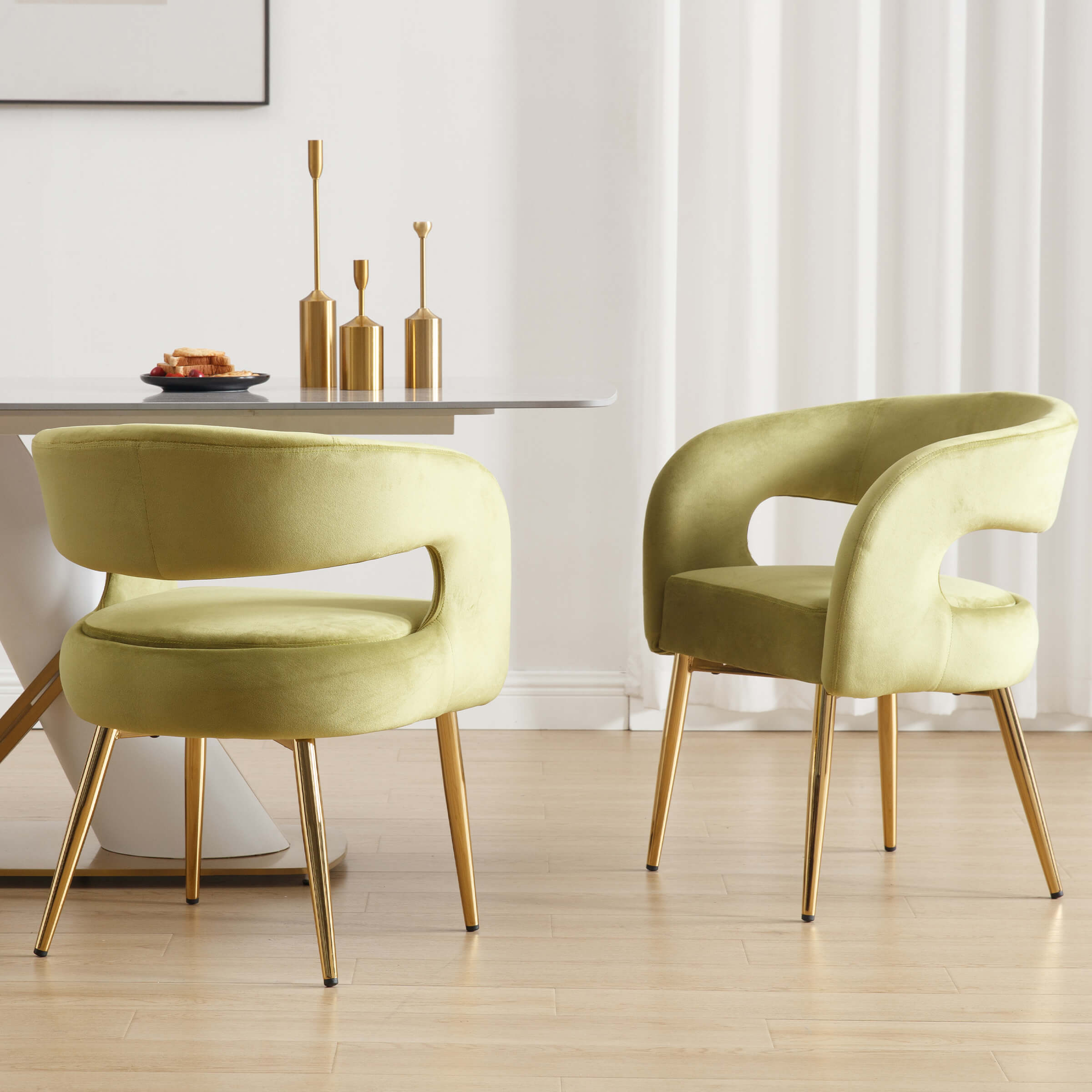 Green velvet chairs in dining setup