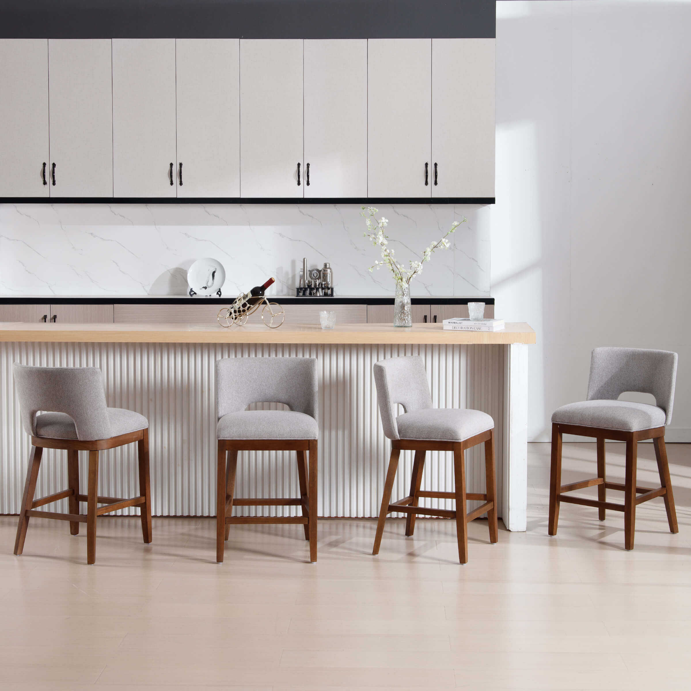 Bar stools by kitchen wall