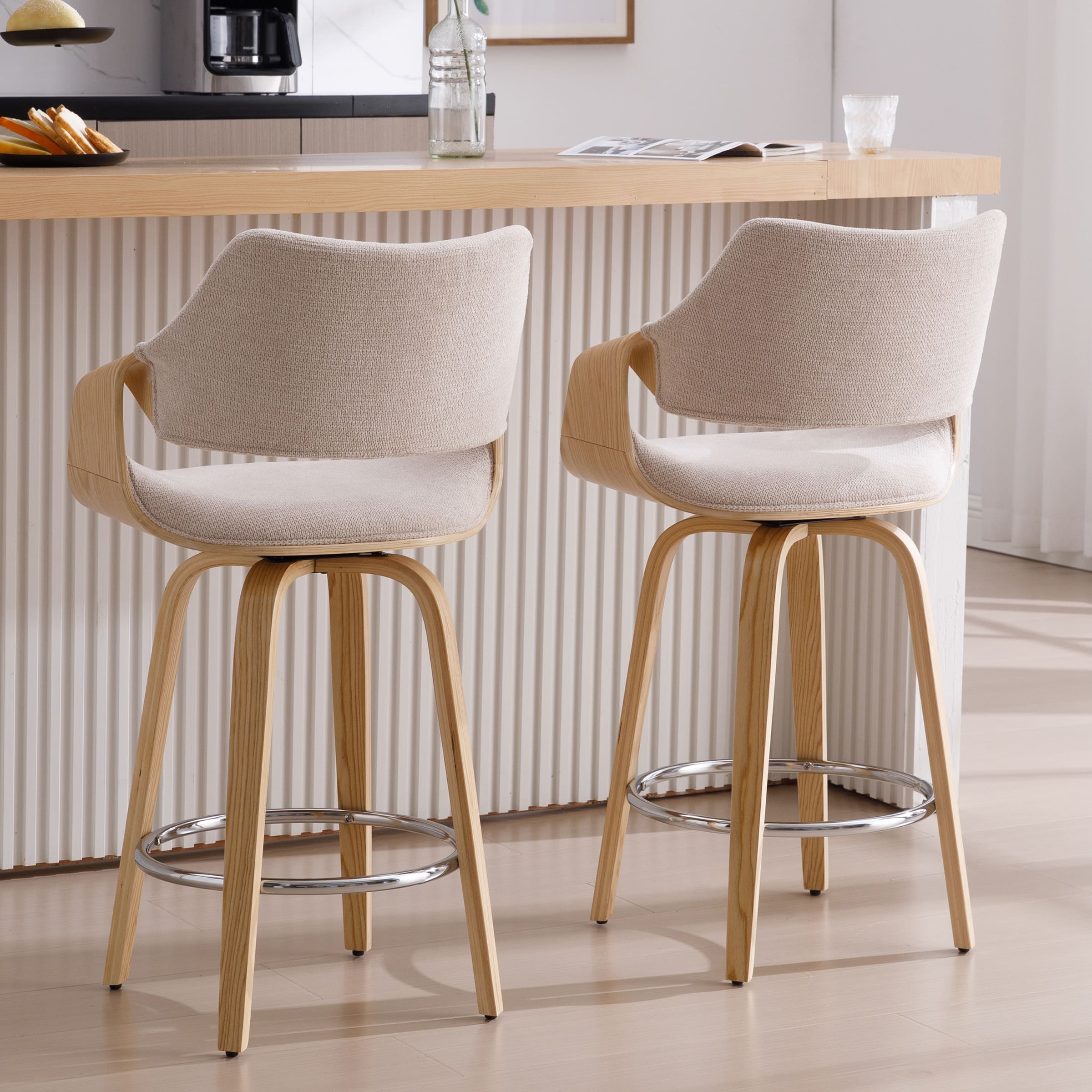 Two beige upholstered bar stools from side and rear view