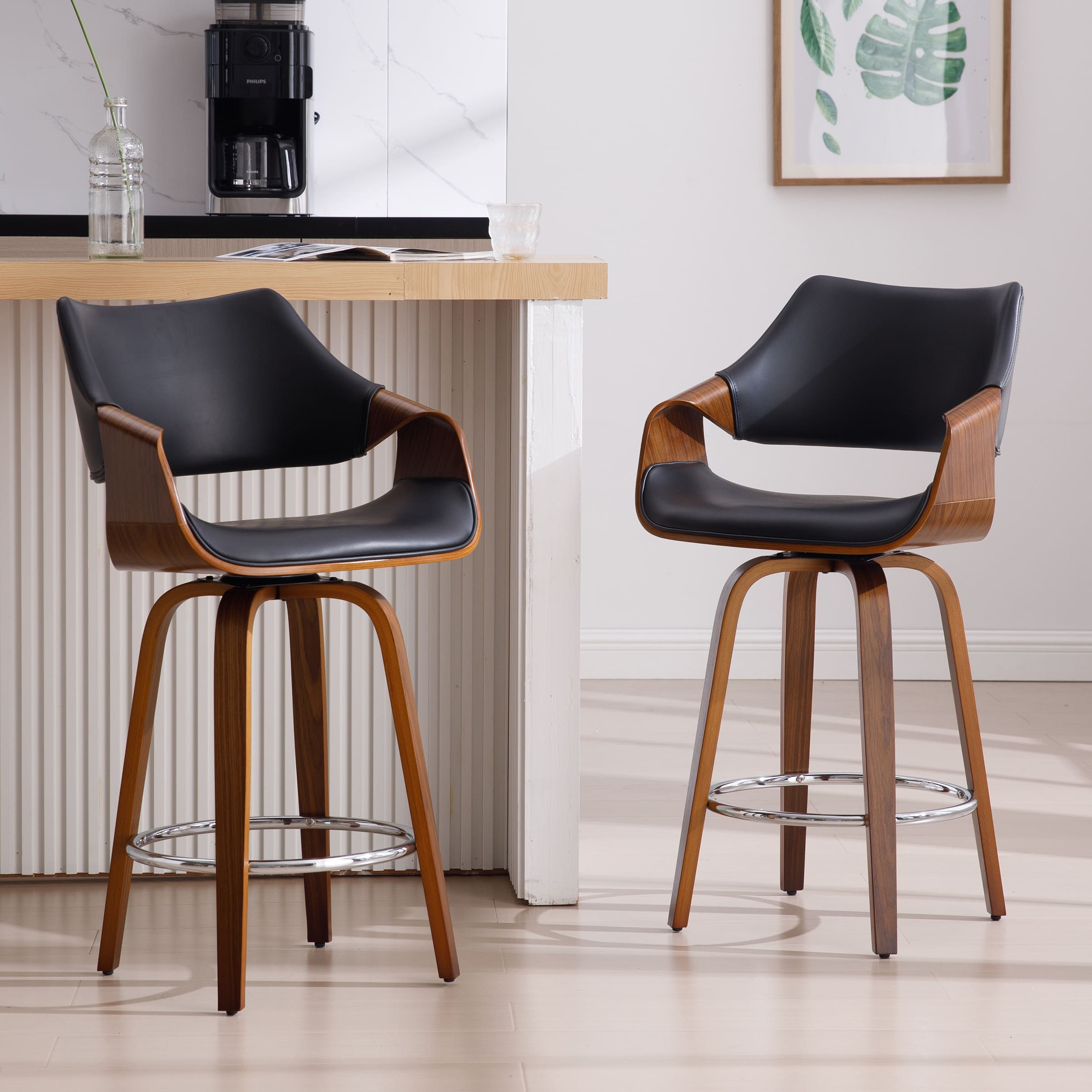 Two stools with black upholstery at kitchen island